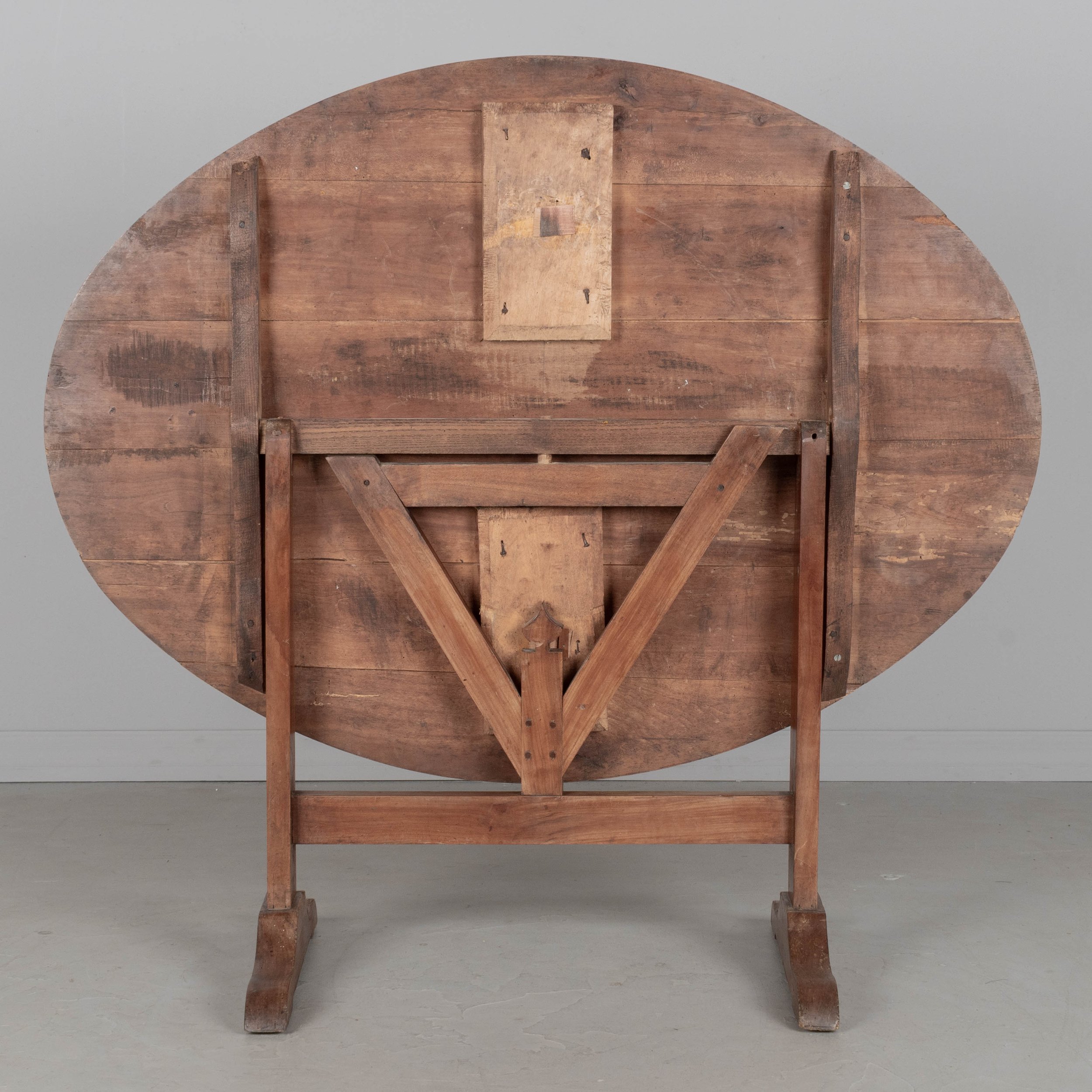 French oval wine tasting, or tilt-top table made of solid cherry.