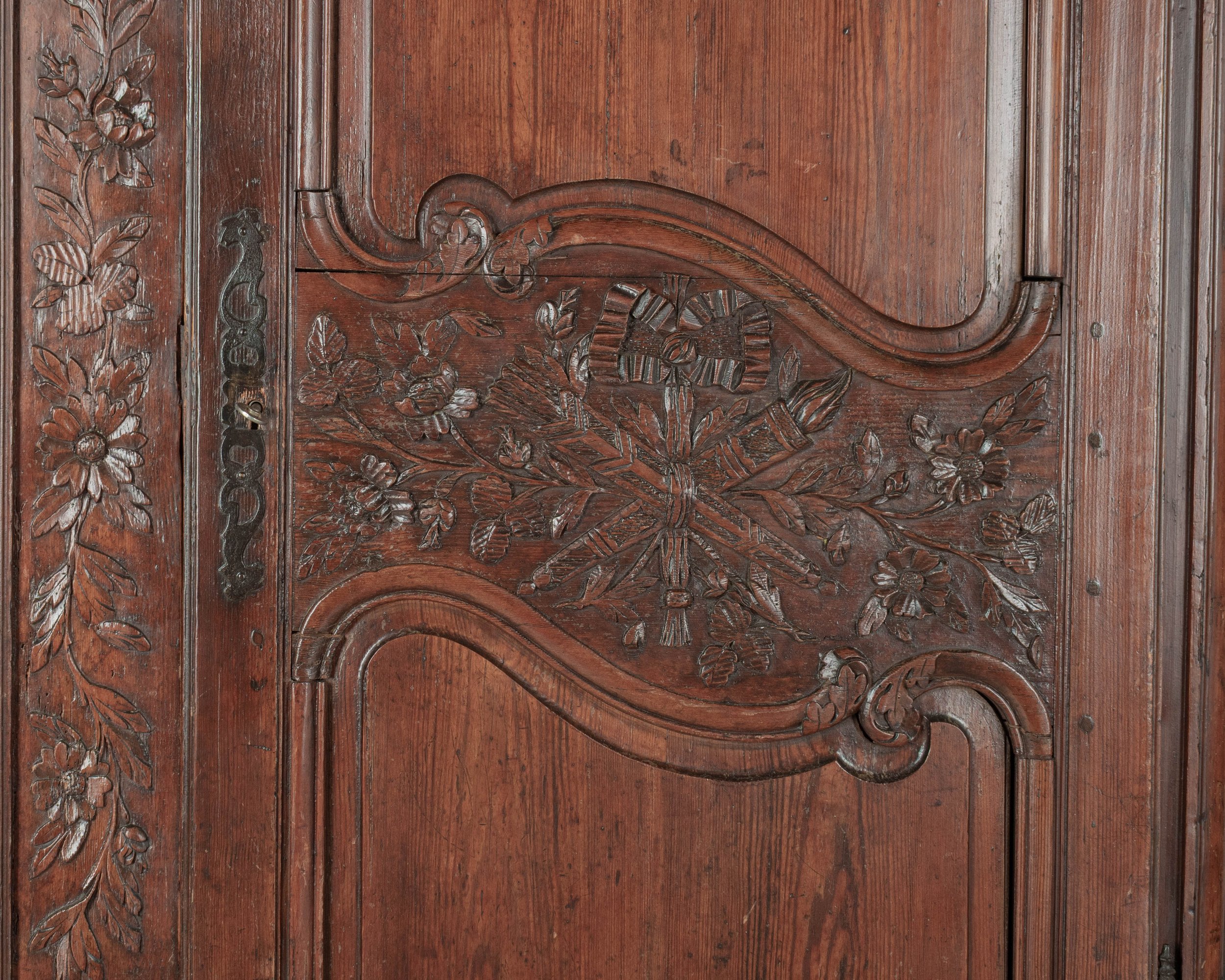 An early 19th century Louis XV country French bridal armoire from Normandy.