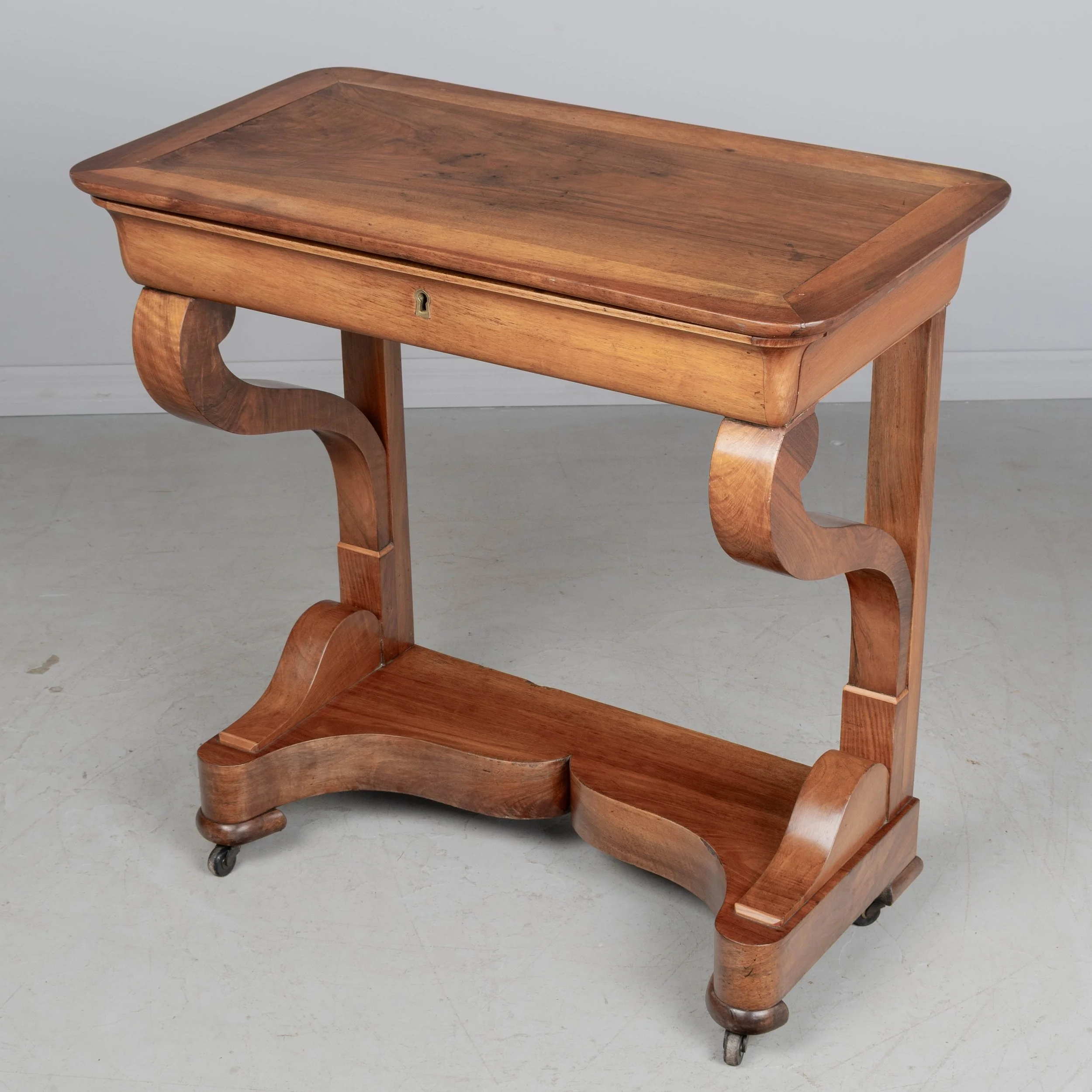 A 19th century French Louis-Philippe console made of solid walnut and veneer of walnut