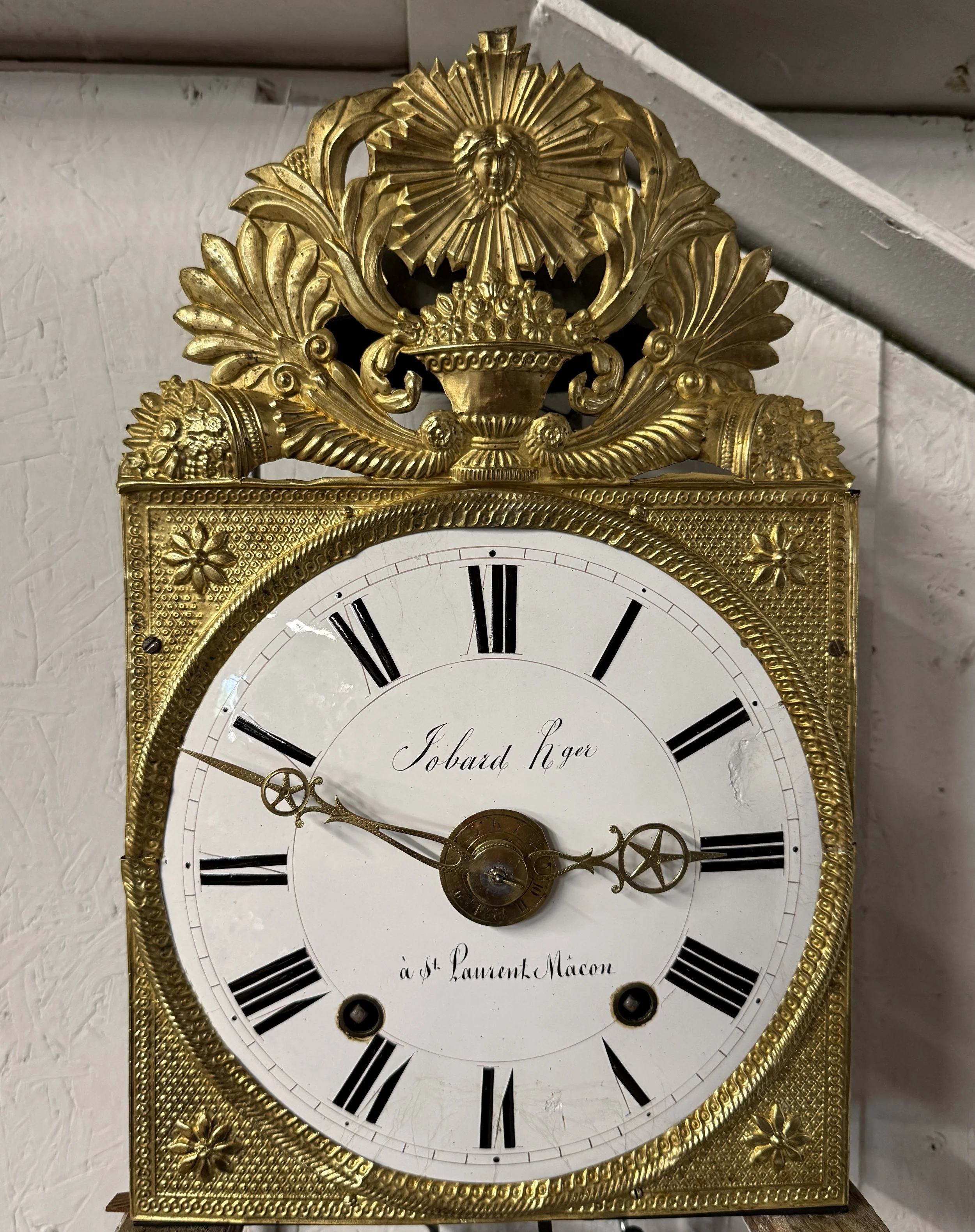 A late 19th century Morbier works for a tall case clock from Jobert Horloger at St Laurent Mâcon with brass embossment of Sun King