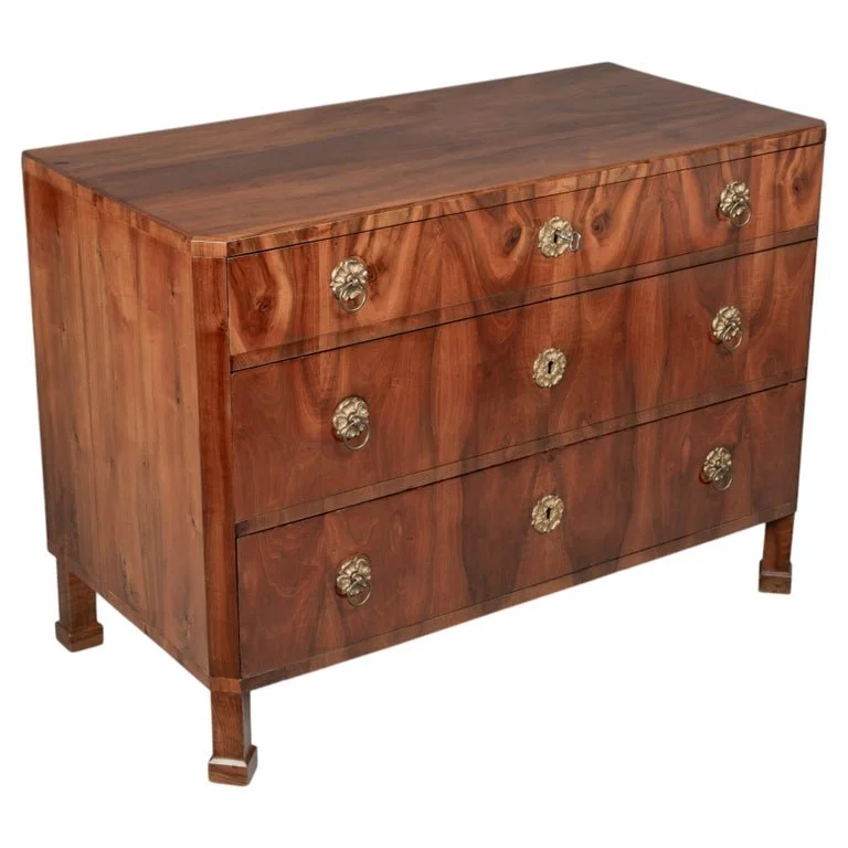 A fine 19th century Biedermeier commode from Austria made with beautifully patterned book matched veneer of walnut over pine.