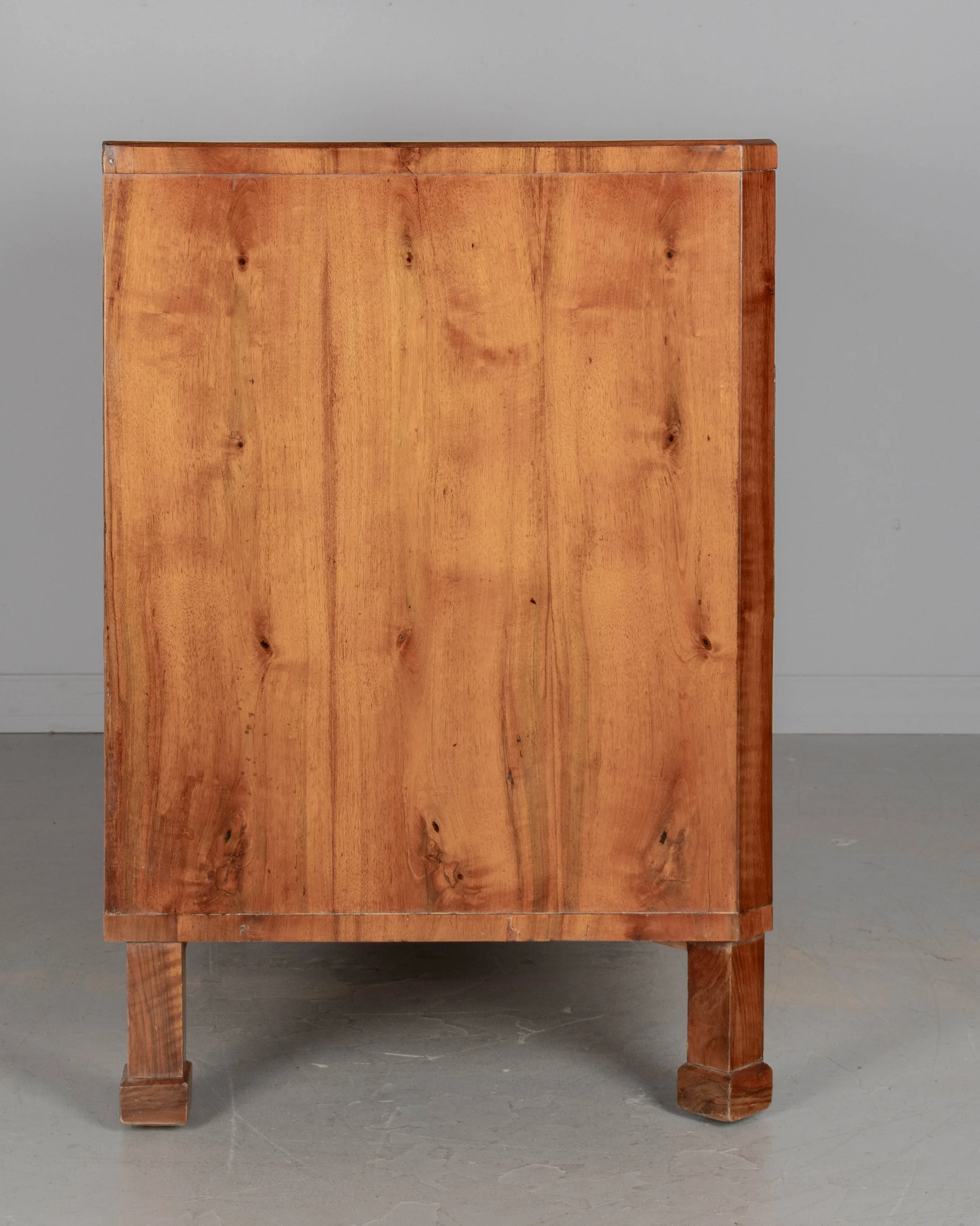 -A fine 19th century Biedermeier commode from Austria made with beautifully patterned book matched veneer of walnut over pine.
