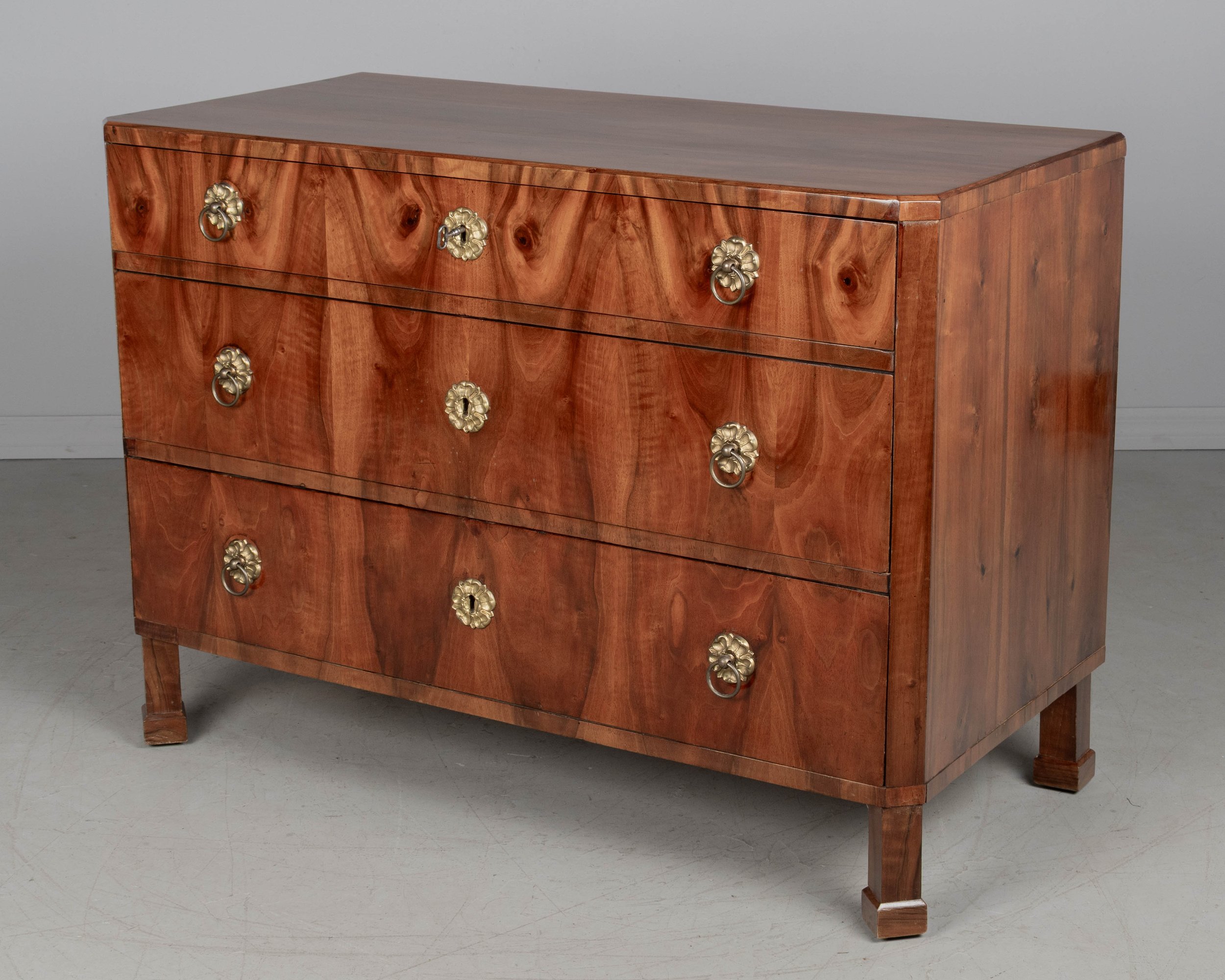 A fine 19th century Biedermeier commode from Austria made with beautifully patterned book matched veneer of walnut over pine.