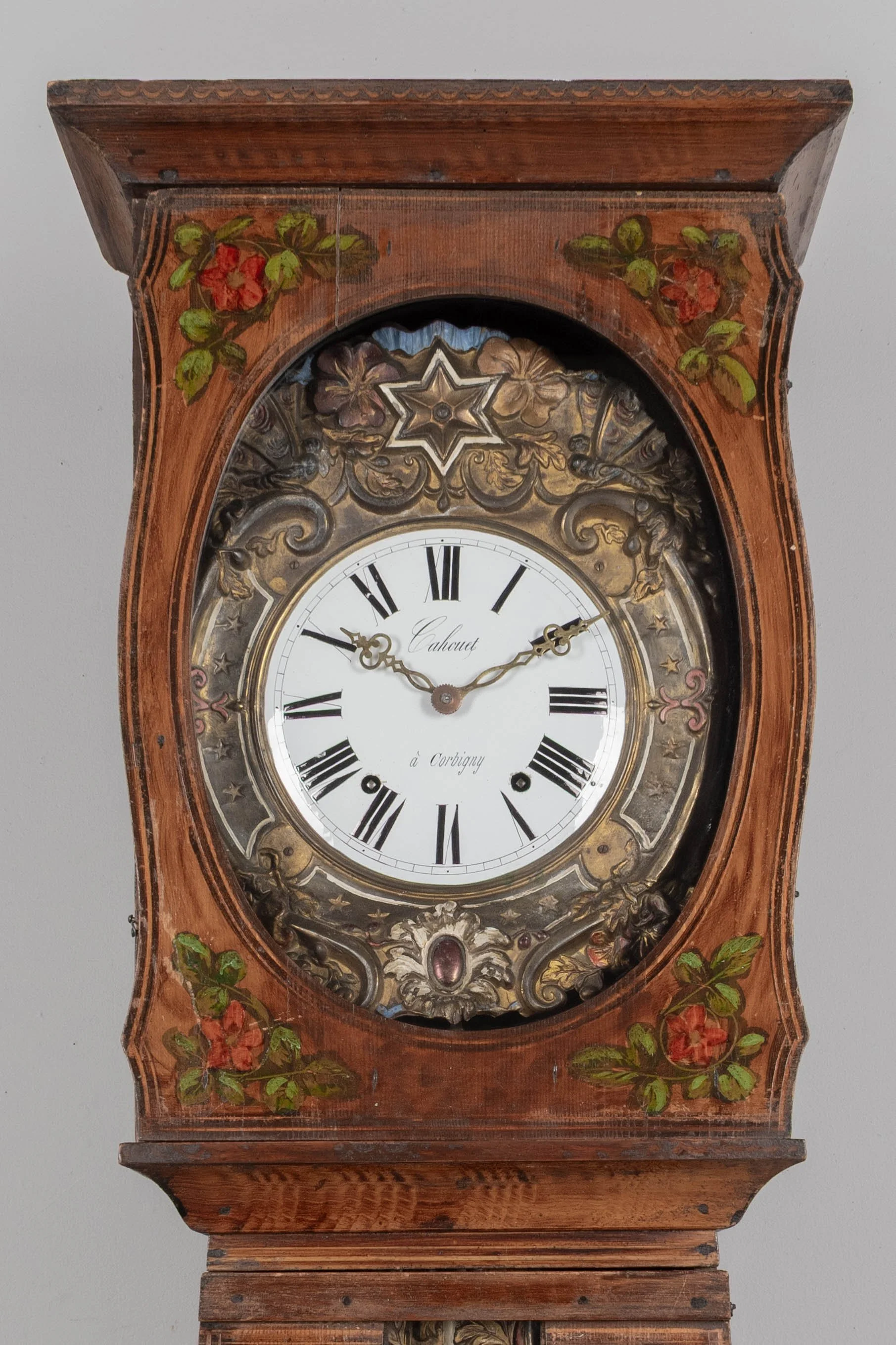 19th century Country French comtoise, or grandfather clock, with polychrome painted pine case and embossed brass pendulum.