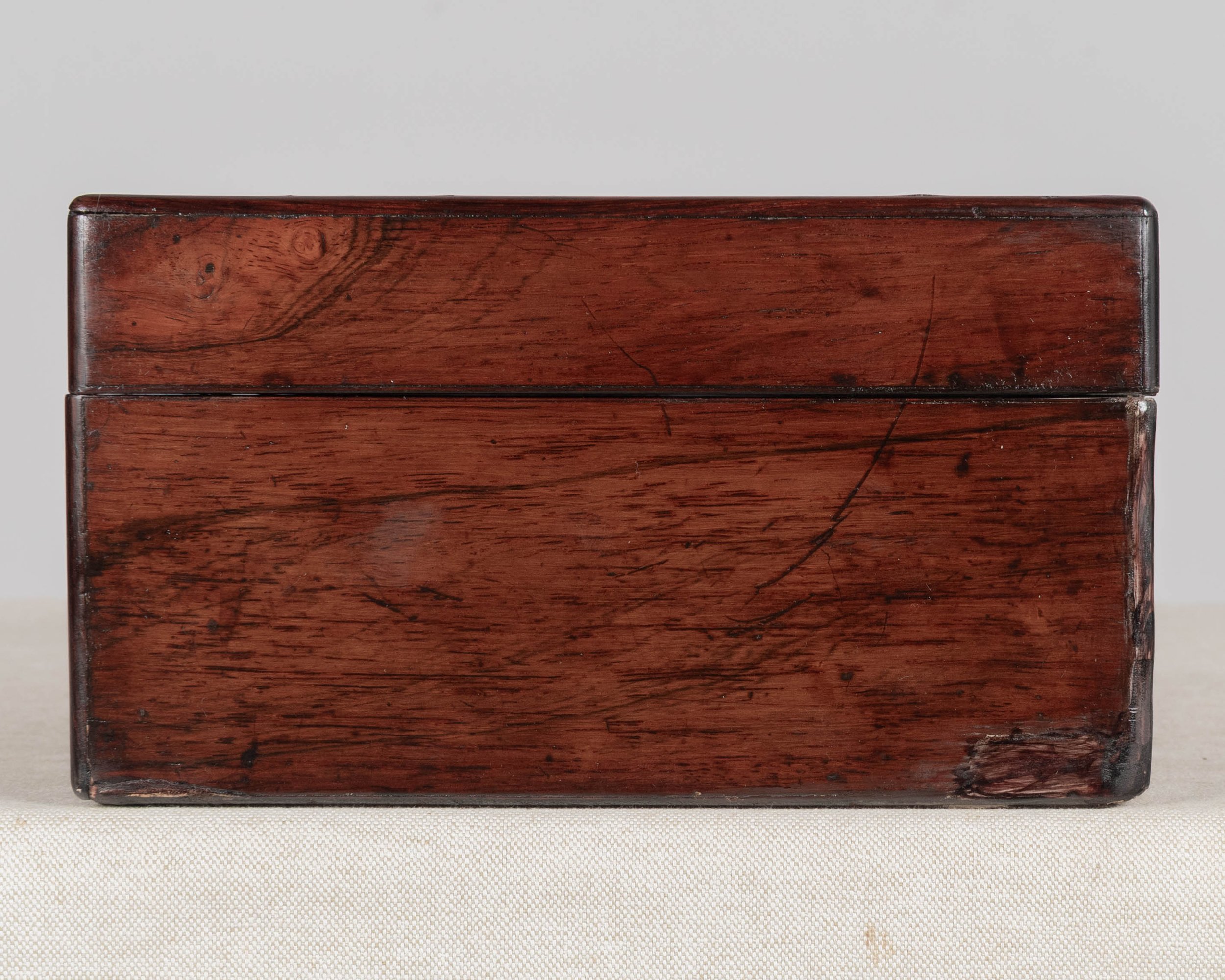 A 19th Century French Napoleon III marquetry box made of rosewood veneer with fine mother-of-pearl and brass inlay.