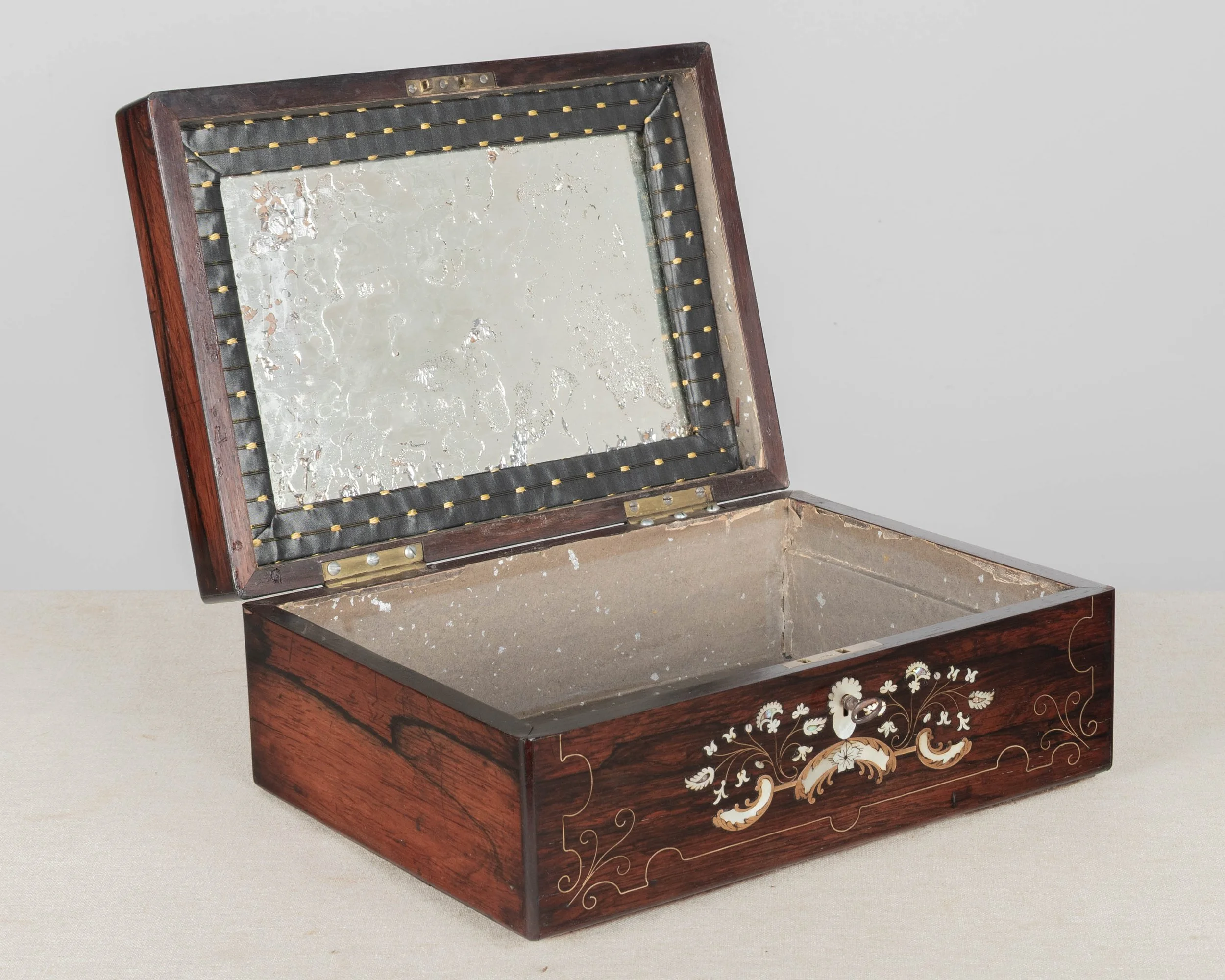 A 19th Century French Napoleon III marquetry box made of rosewood veneer with fine mother-of-pearl and brass inlay.