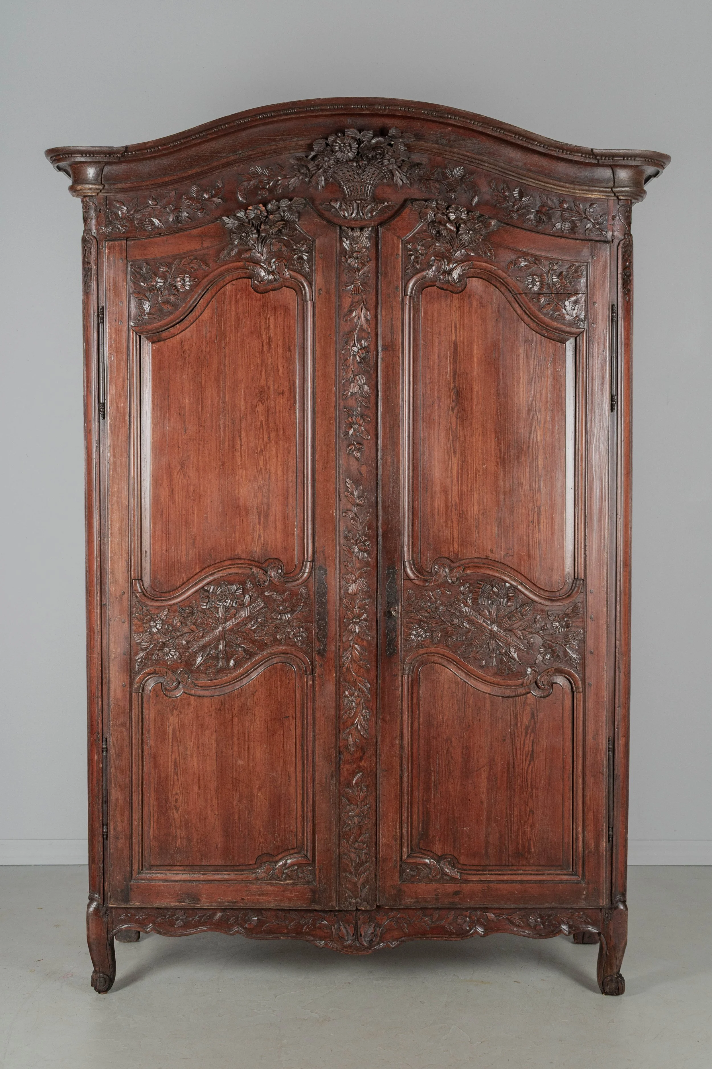 An early 19th century Louis XV country French bridal armoire from Normandy.