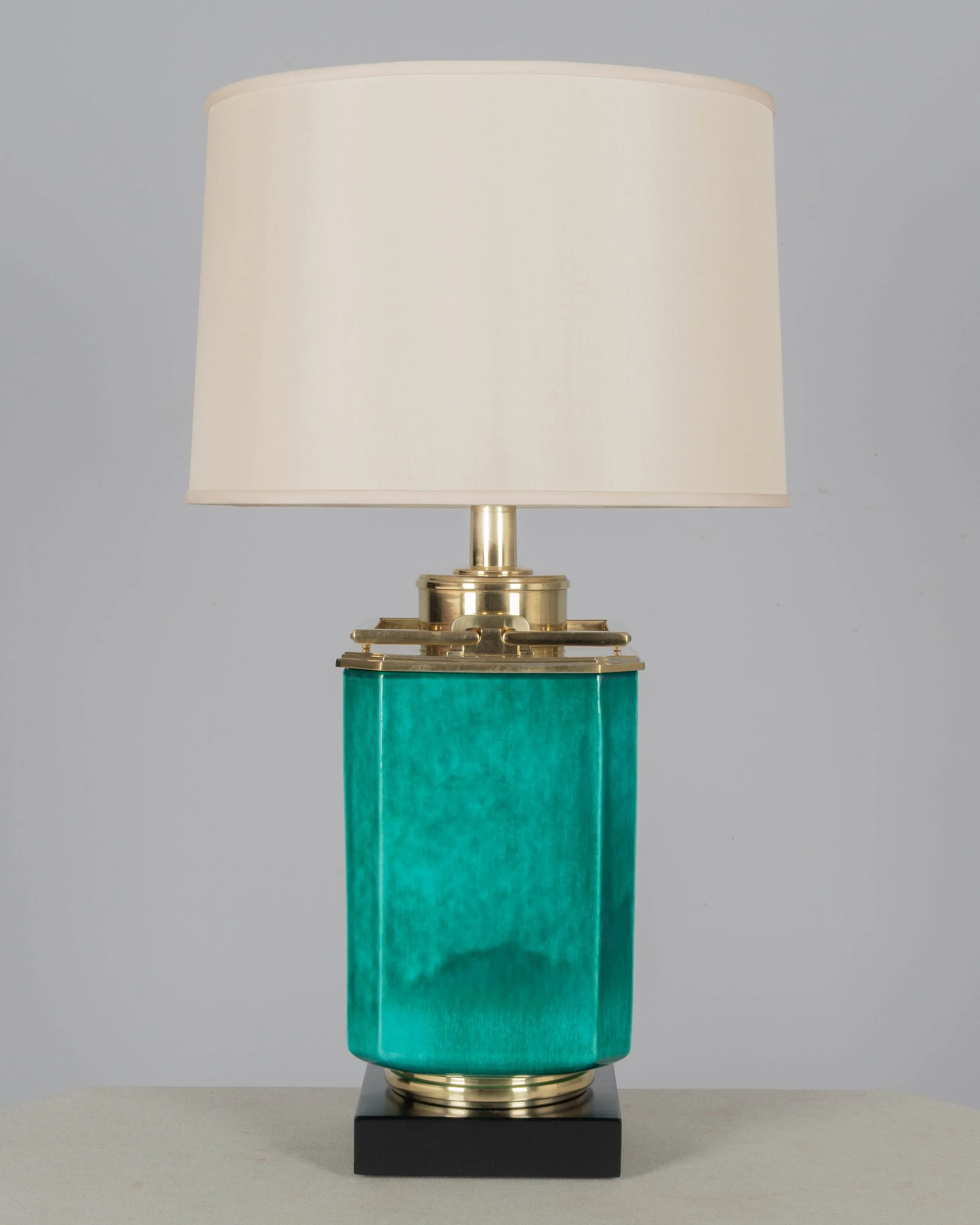 A Mid Century table lamp by Edwin Cole for Stiffel. Large octagonal deeply saturated heavy glazed ceramic body in beautiful shade of turquoise,