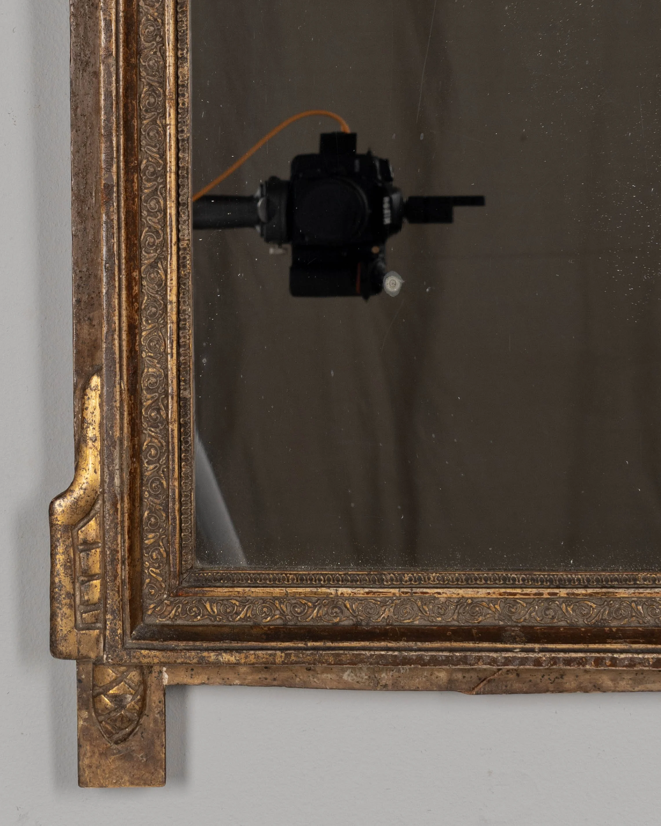 An early 19th century Louis XVI style French Provençal giltwood mirror.