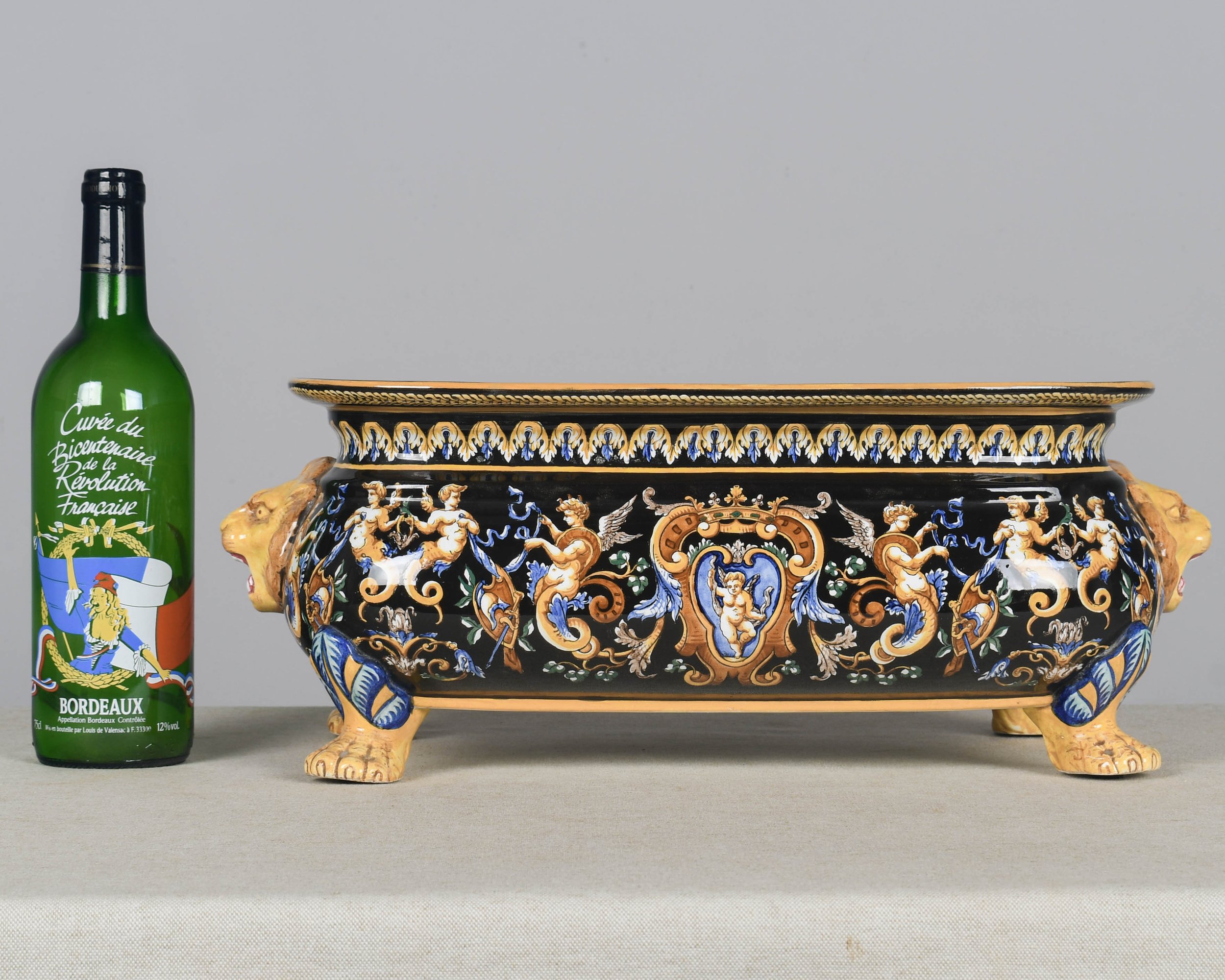 A late 19th century French Gien faience ceramic jardinière, or shallow footed centerpiece bowl.