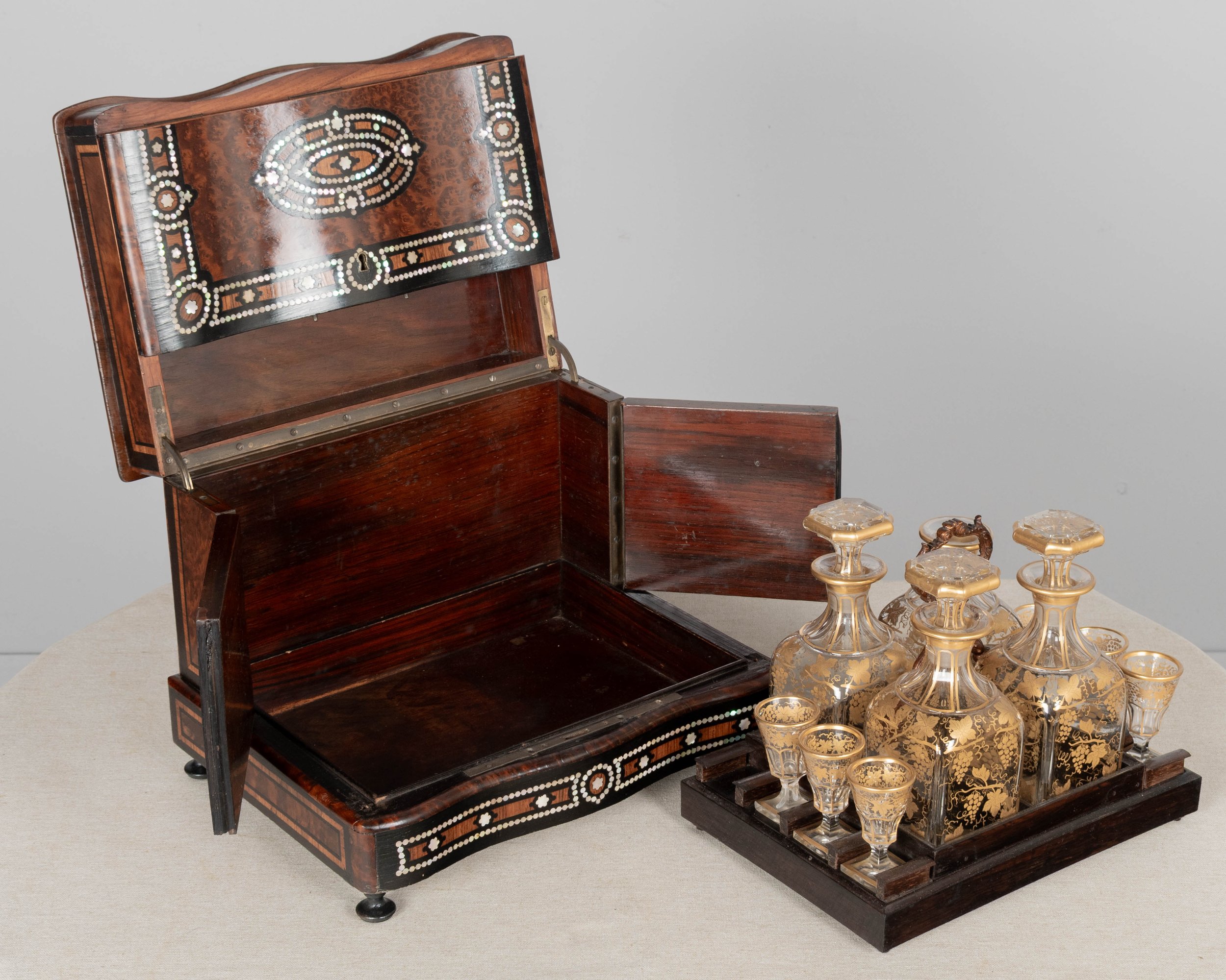 A fine 19th century French Napoleon III tantalus, or cave à liqueur, in the style of Charles-Guillaume Diehl