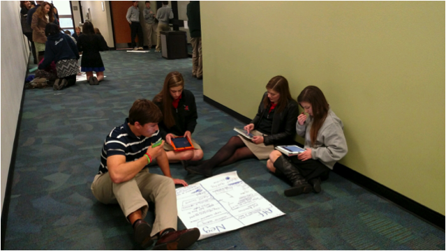 Florence Academy students prepare points on a practice debate resolution