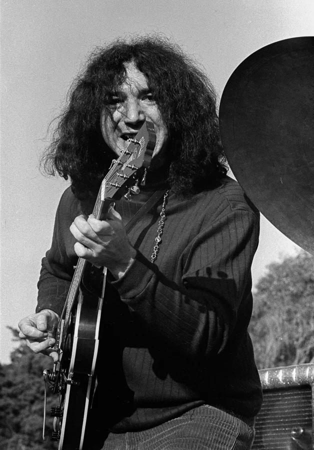 Jerry Garcia at the Human Be-In, grinning as he took a solo.