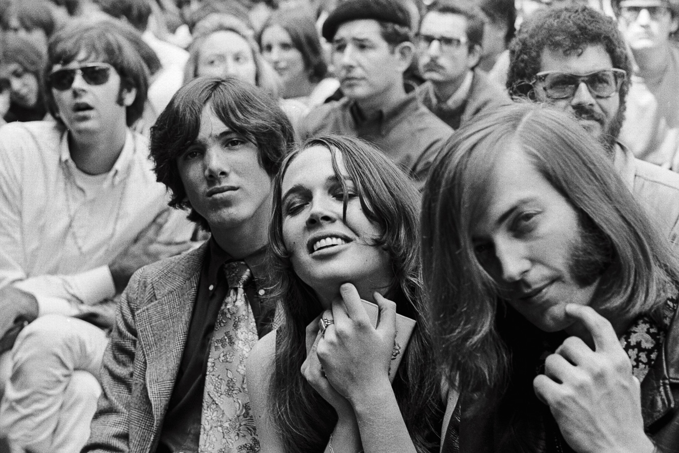 A young woman's joy in the music transcends the emotions of those around her, including her friend Sam Andrew (right) of Big Brother and the Holding Company.