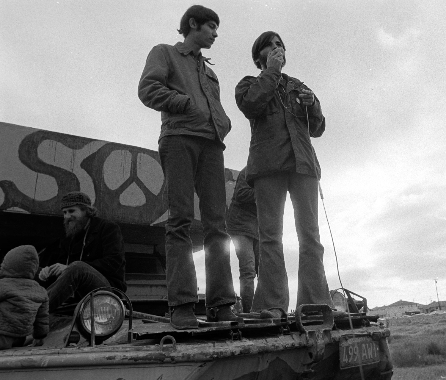  Bobby Musa (left) and Larry Harris (right), speaking at a street corner rally near the main gate to NAS Alameda. For many of the sailors, speaking their mind from street corners and public stages was a new experience. 