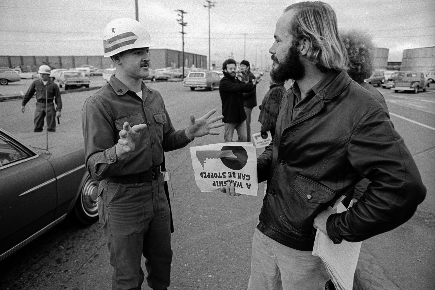  Civilian demonstrators leafletted at the gates to the navy base where the USS Coral Sea and other carriers were docked. Base security "white hats" were told to keep the gates unobstructed. 