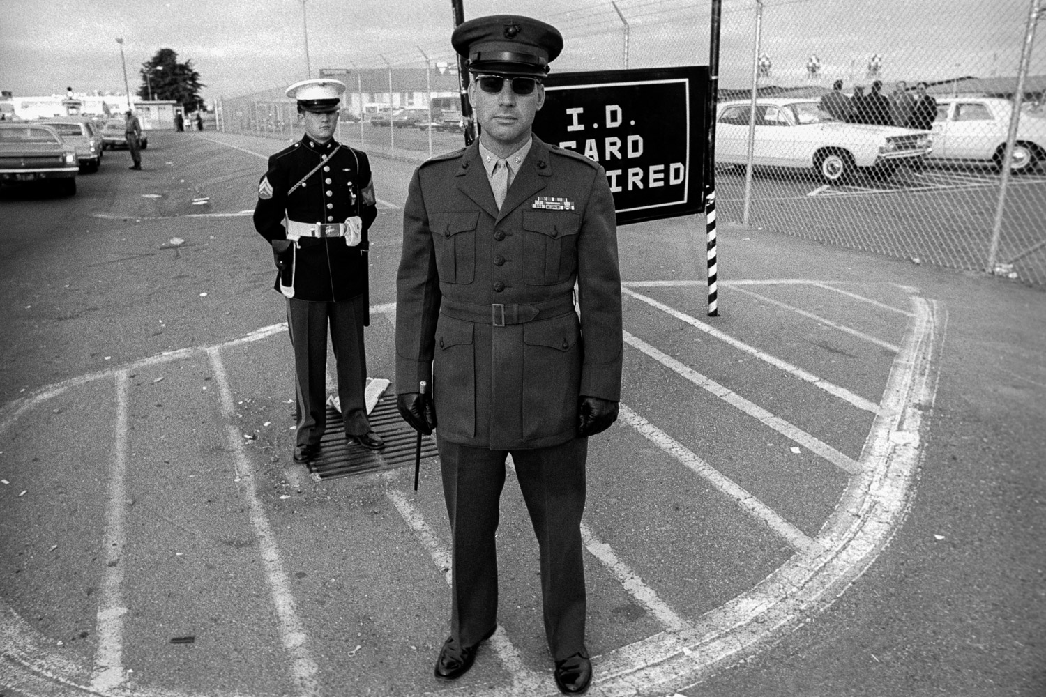  This Marine Corps officer was there to keep the rally from blocking the base gates. Note the riding crop in his right hand. 