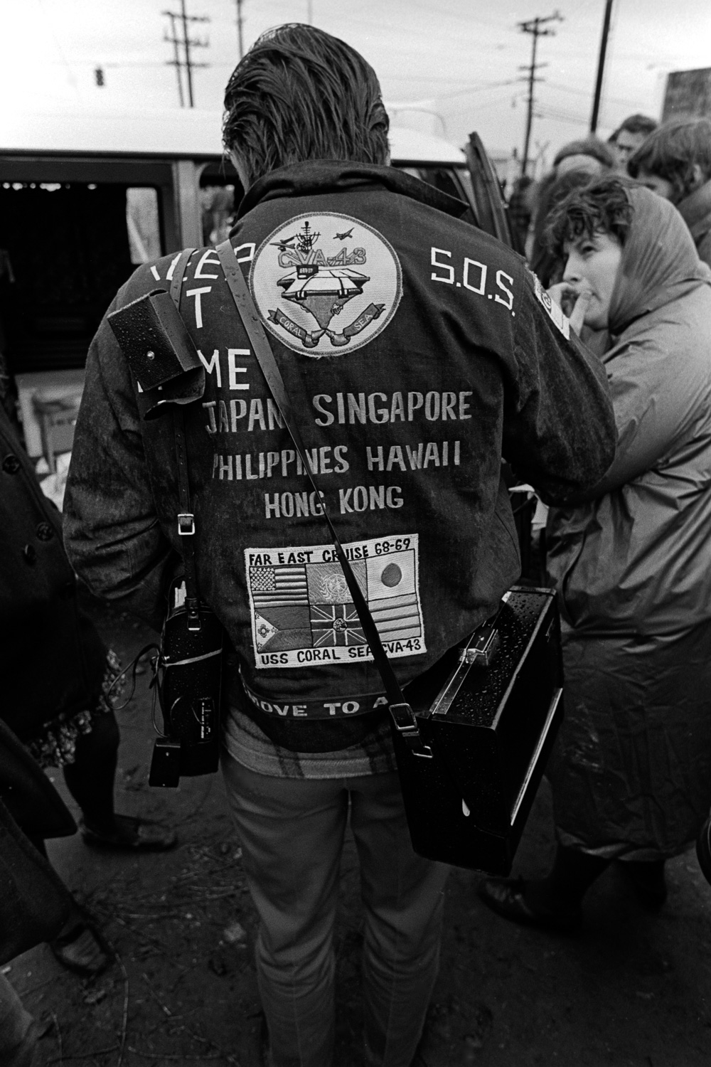  This sailor's jacket reflects the ports-of-call where his ship, the USS Coral Sea, has called. At the top of his jacket, he added: "Keep it home. SOS." 