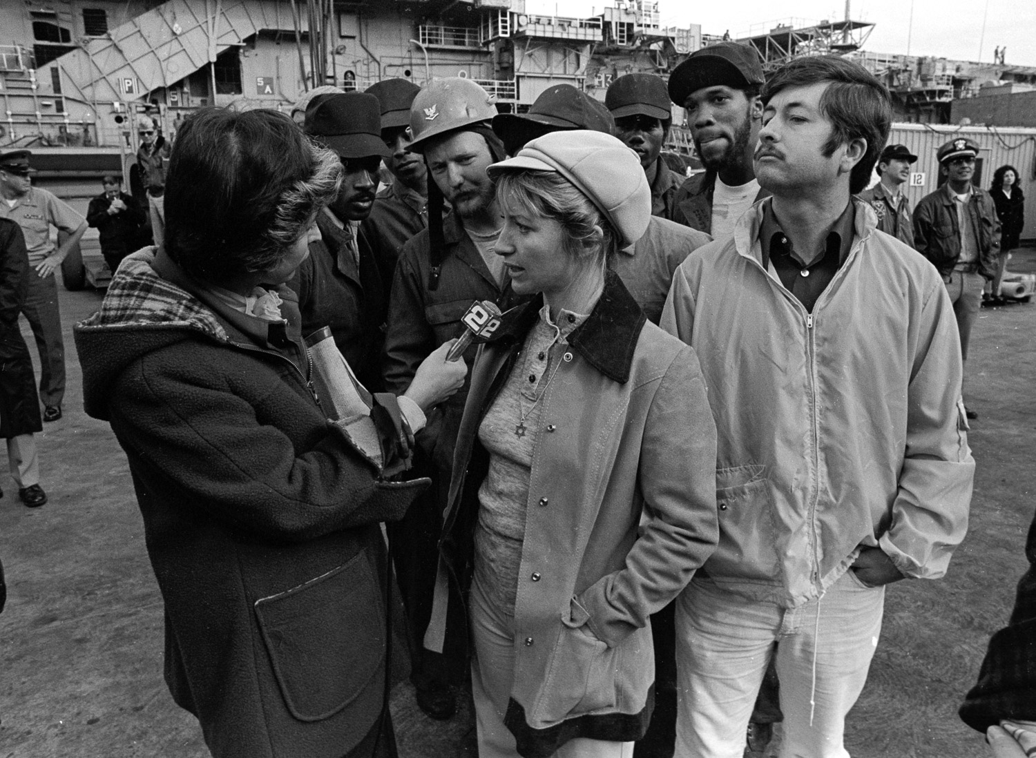  Vicki Kelly, co-leader of the Navy wives' group Save American Vessels, explains to a reporter why they want the USS Coral Sea repaired fully before it deploys in December 1974. 