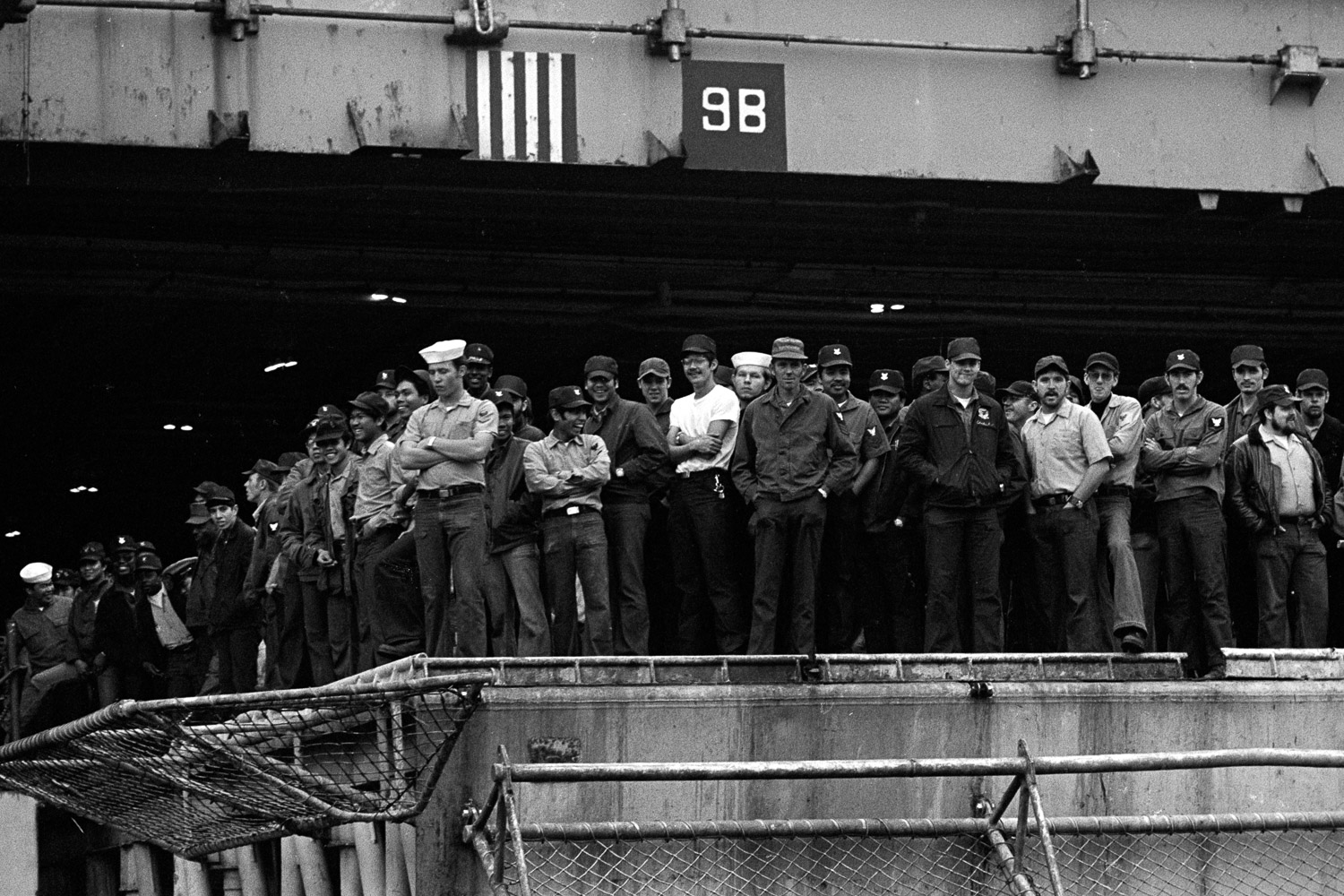  Sailors aboard the USS Coral Sea are looking at friends and family on the pier at NAS Alameda as they get ready to sail. 