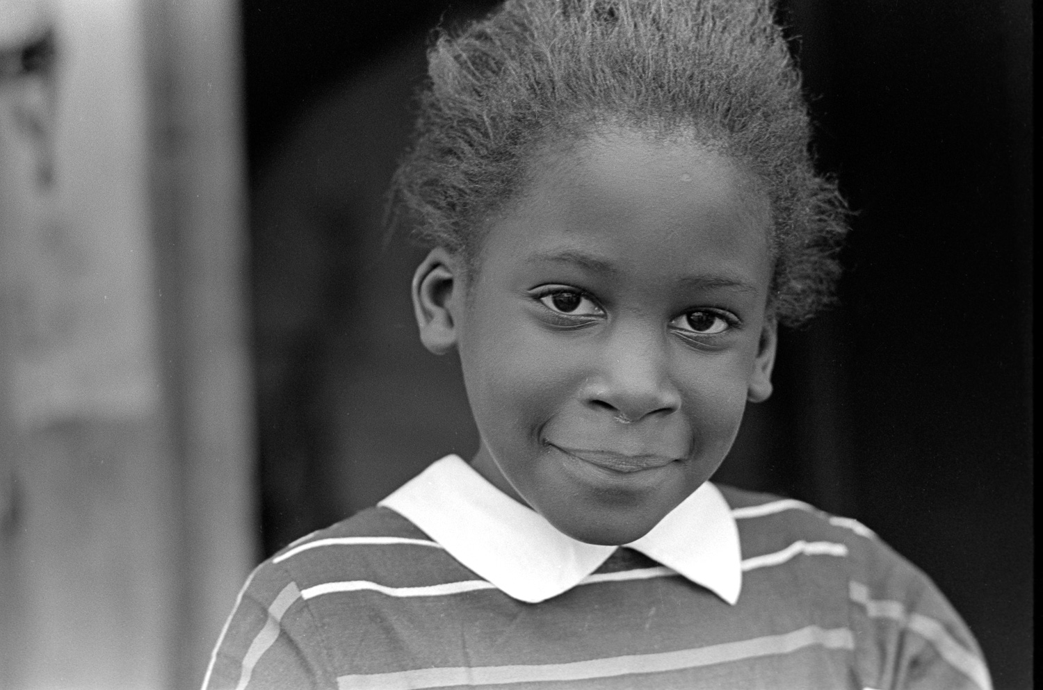 This bright-eyed girl is the daughter of farm workers, and she isn't shy.