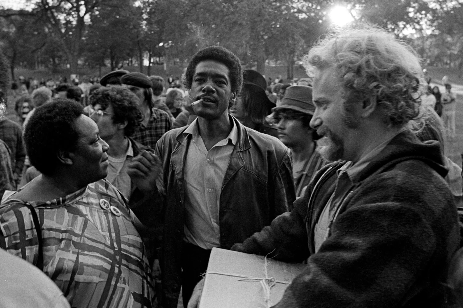 Bobby Seale (center) and Stew Albert (right) and an unidentified leader of the civil rights movement (left) at Lincoln Park in Chicago during the Democratic Convention, August 1968