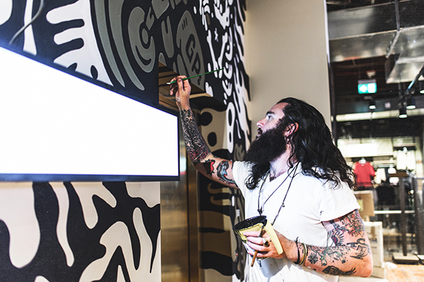 Painting around obstacles. This (blinding) light would soon wear the General Pants Co logo.