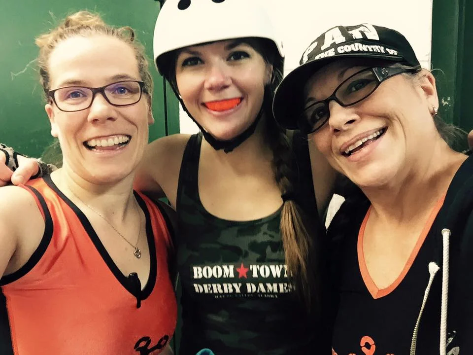 Sally (center) with Spenard Itch (left) and Pat Riot of Rage City Rollergirls