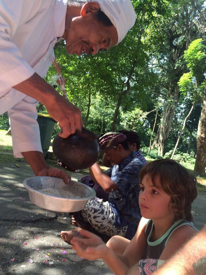 We had to drink holy water and he sprayed it on us. Then we had to eat rice and he put it on my forehead