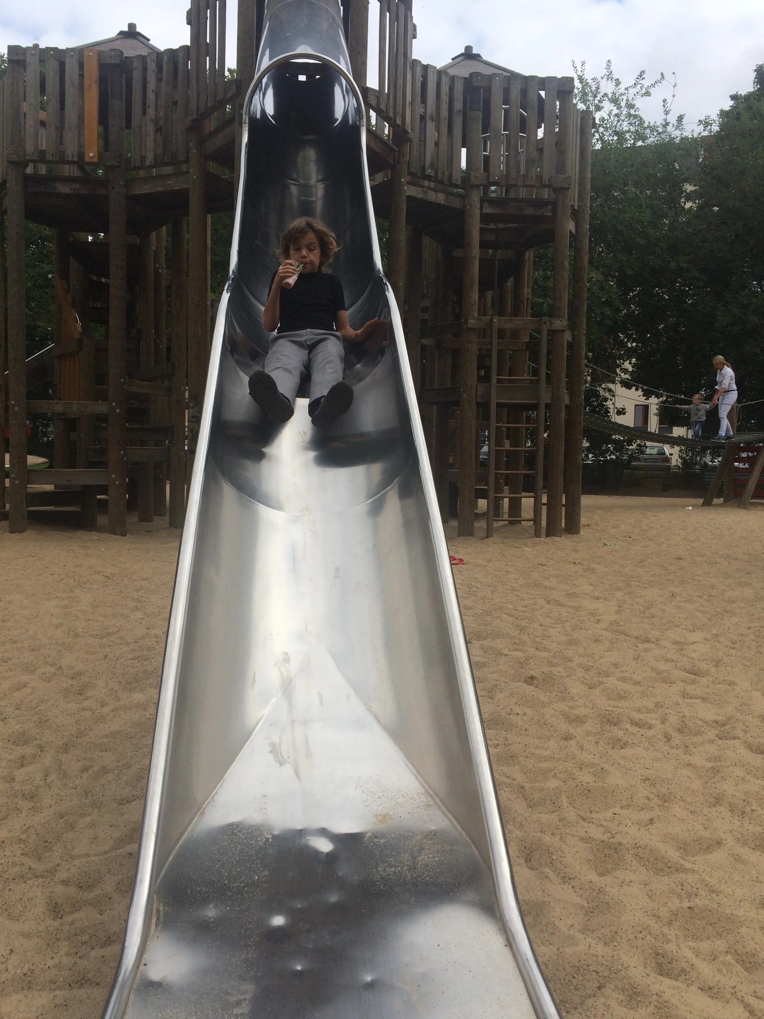 There a lot of parks in berlin. There are lot of parks in Berlin because everyone lives in apartments. The children don't want to stay inside so everyone comes to the parks to play. The parks are better here than Australia because they have bigger slides. The slide is really fun. It felt really weird going down the slide because there was a big bump in the middle. i found four friends to play with. They spoke english. 