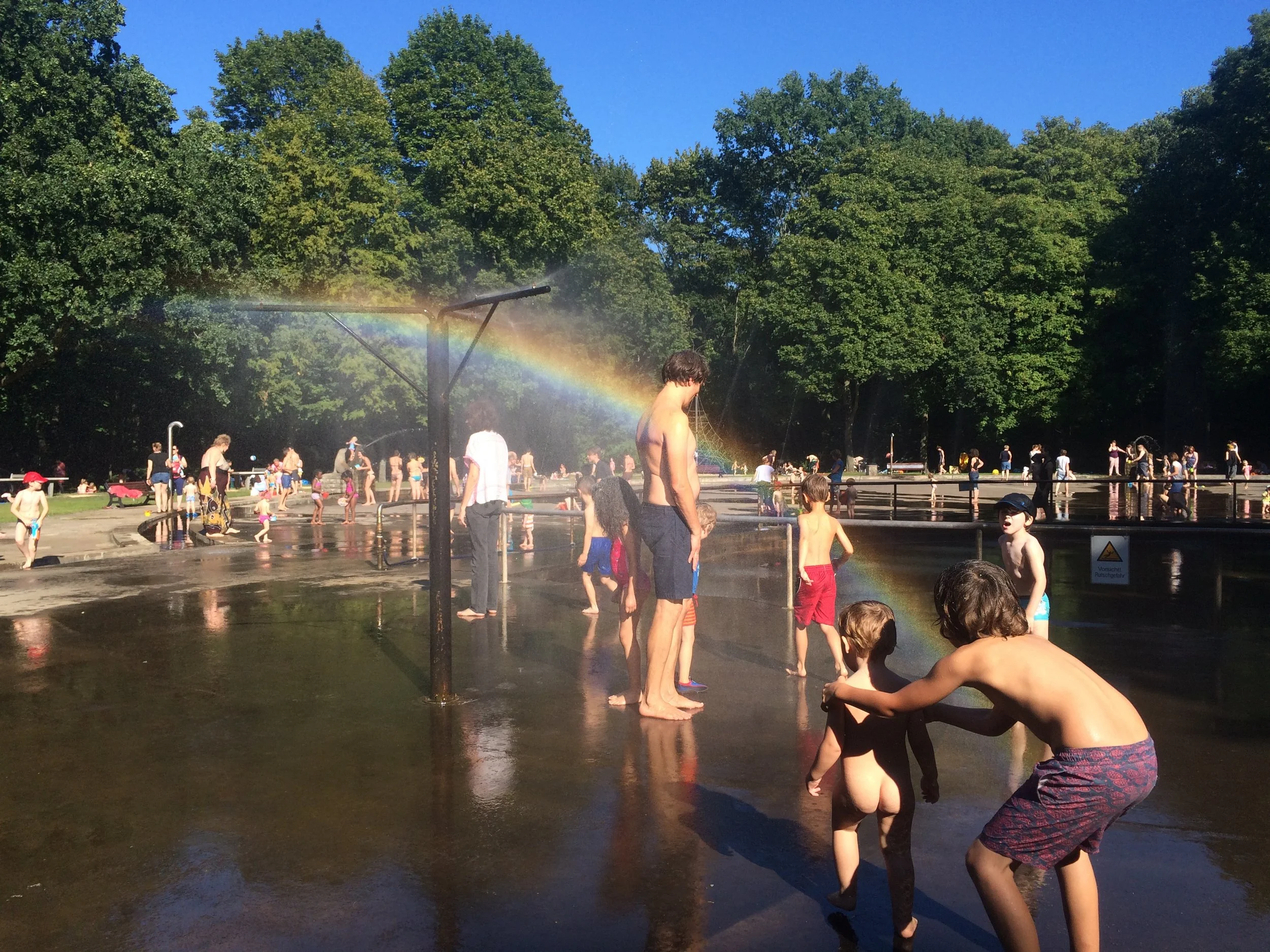now you can see the rainbow! Everybody was having fun. I had an icecream. Mine was chocolate and Hugo's was strawberry. 