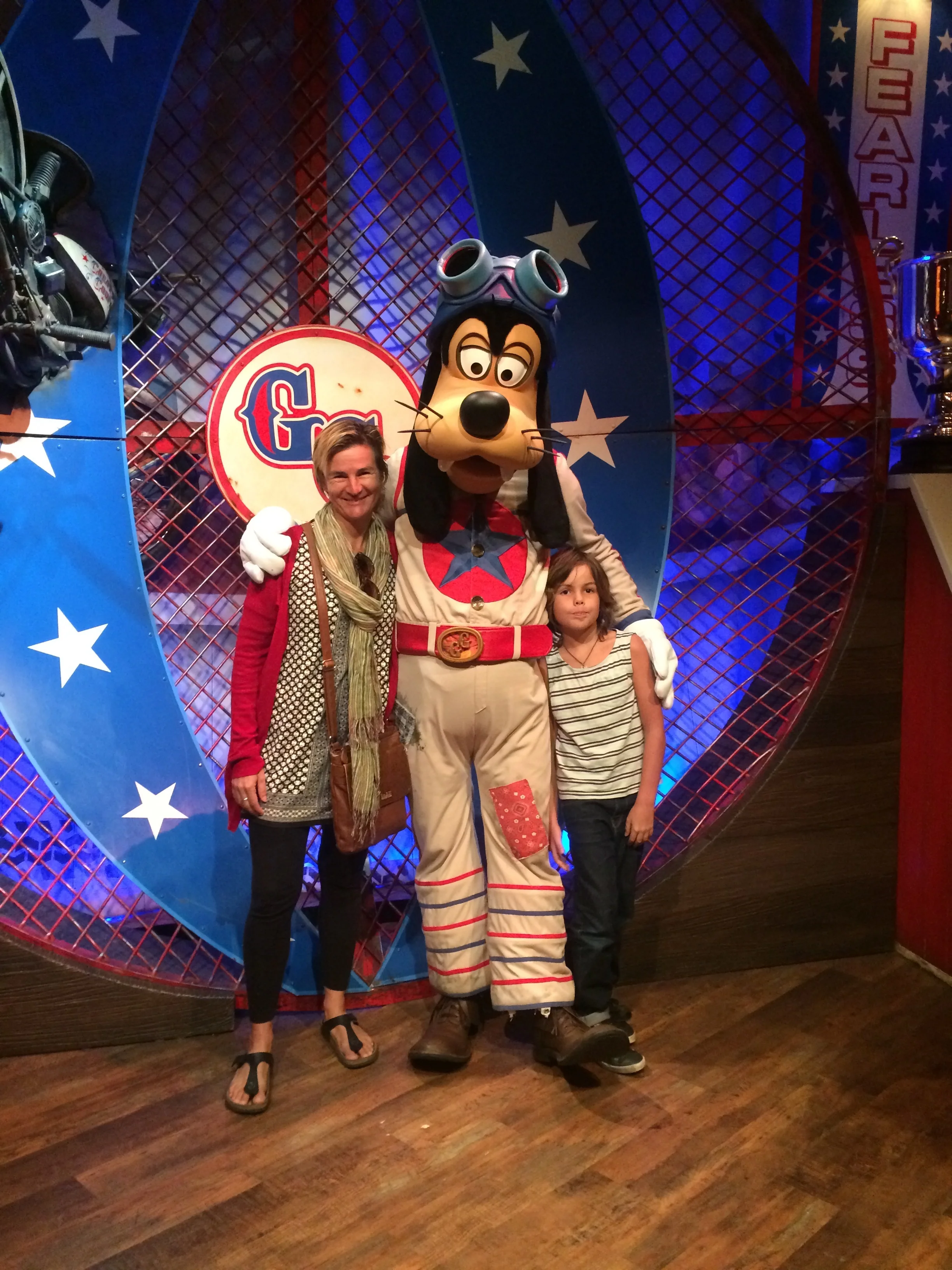 there was this place called clown town and i got a photo with Goofy which was awesome. i went on a ride which was a roller coster which had turn and a big drop . that was my first ride . This was called the Barnstormer. I was scared at first but it was fun. I went on it twice.