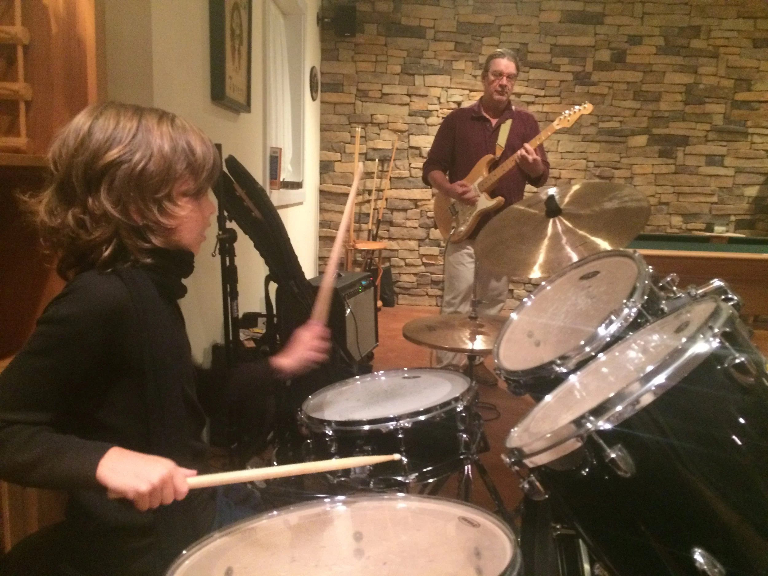 At a friends place, HB and Anne, we play rock and roll which was fun i was the best at the drums . They had a downstairs basement filled full of guitars, drums and trumpet. It was so much fun.
