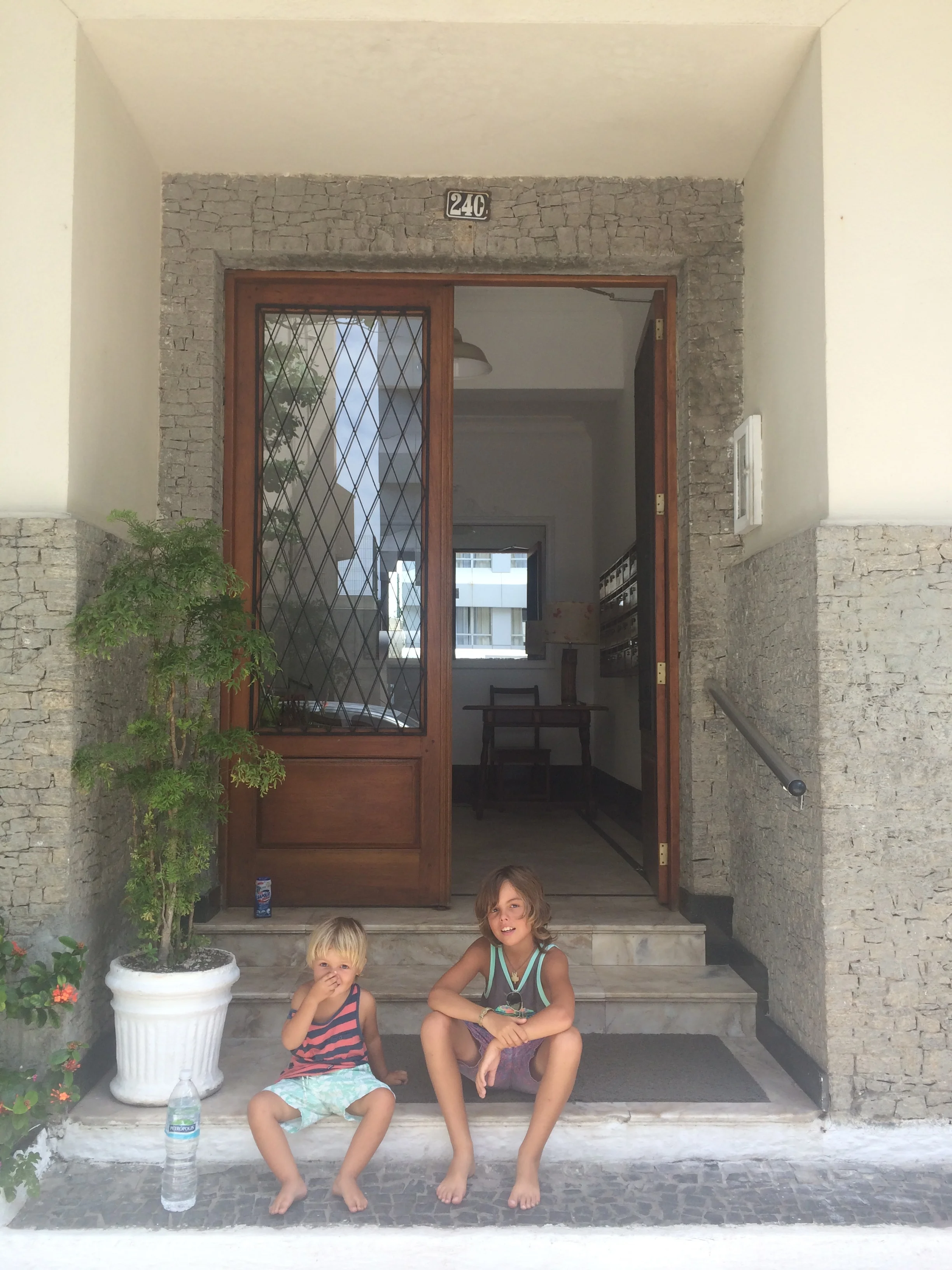 this is the front of the apartment where we live in rio i like it our beds are really confutable to sleep in and i have my own tv so i am relaxed.