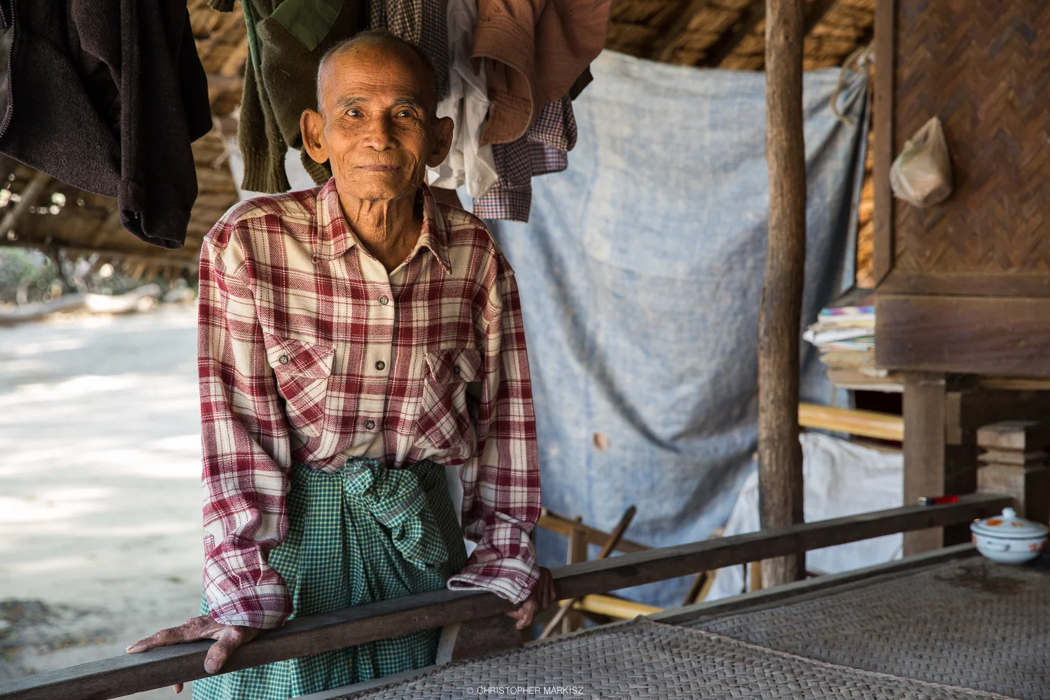 An elderly man proudly poses for a portrait at his home in Bagan, Myanmar.