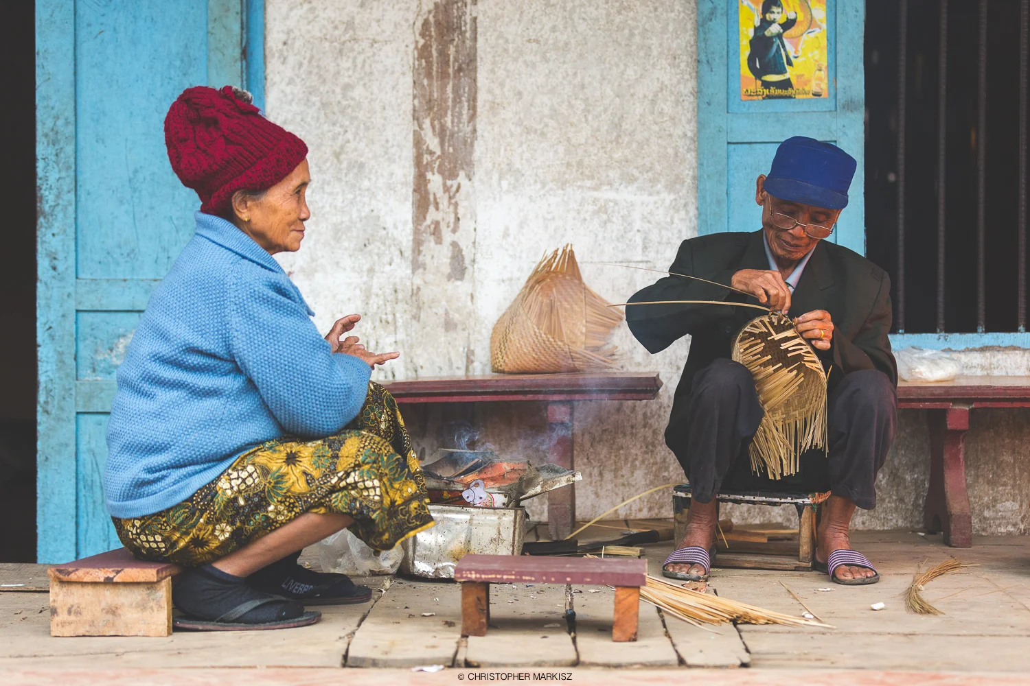 A man weaves together bamboo rice steamers in Luang Prabang, Laos.