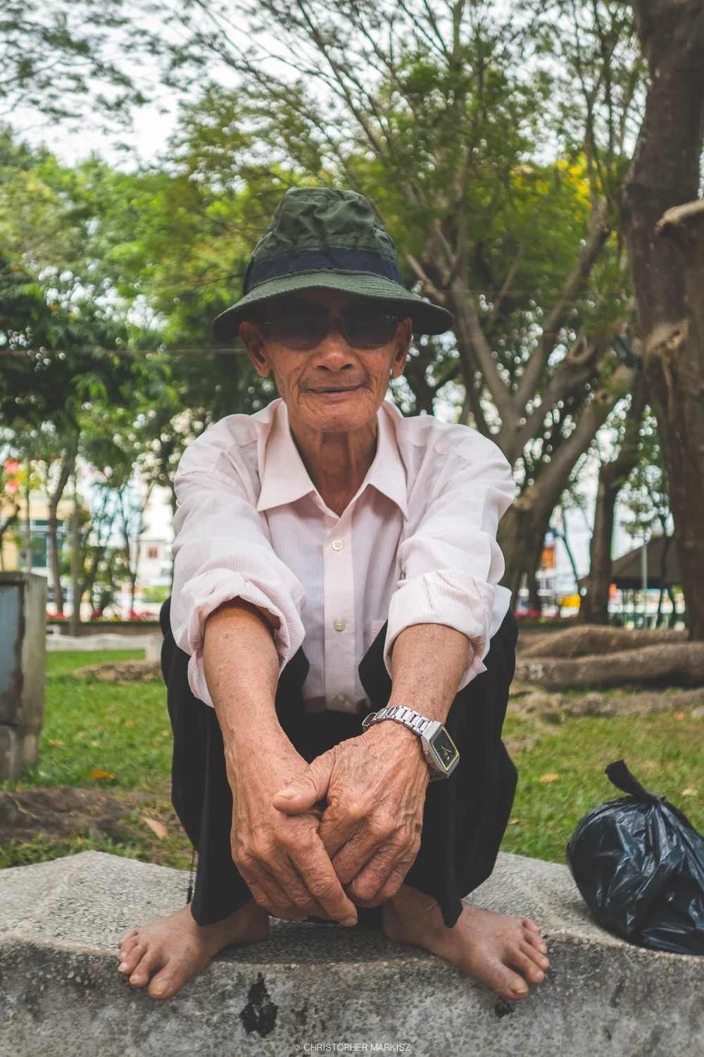 A man poses for a portrait in Saigon, Vietnam.