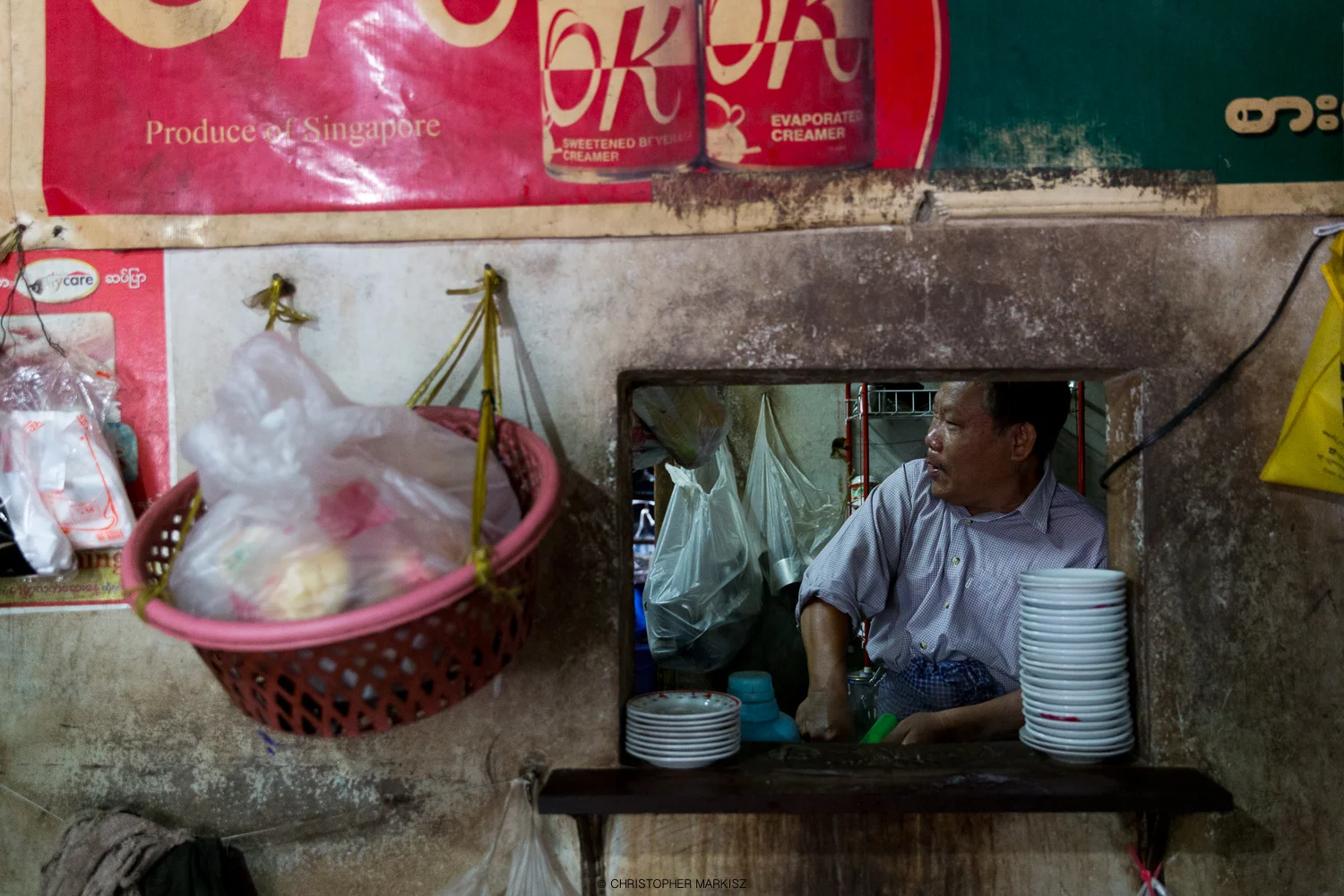 A Mawlamyine, Myanmar cafe owner preparing food I just ordered.