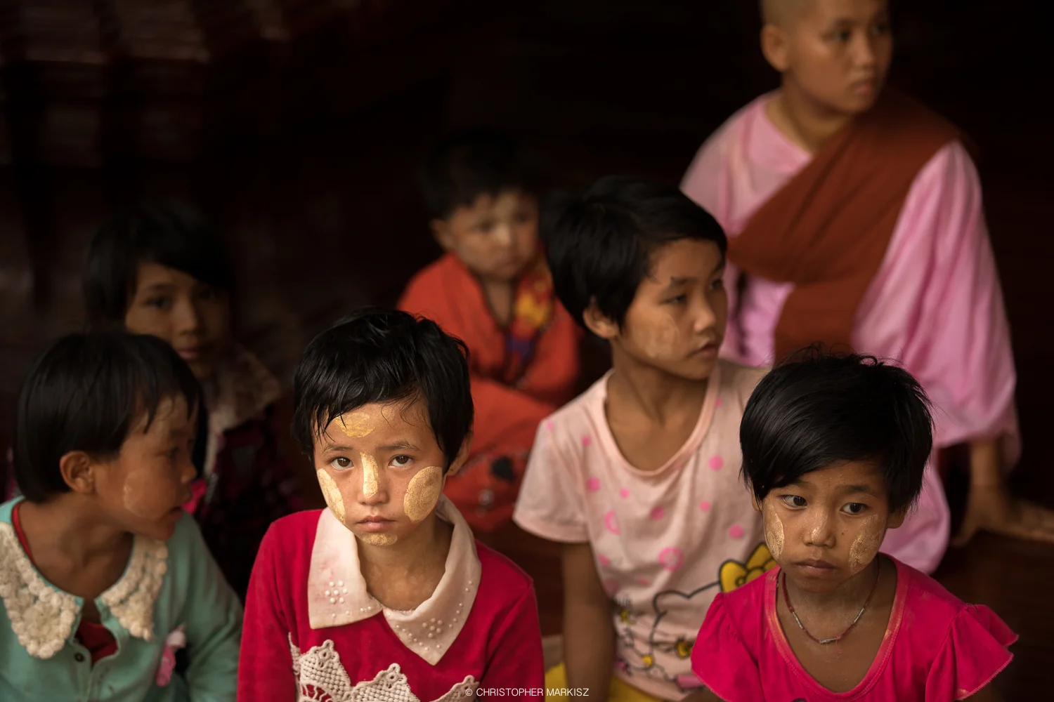 Children and a novice nun at Shwedagon Pagoda in Yangon, Myanmar.