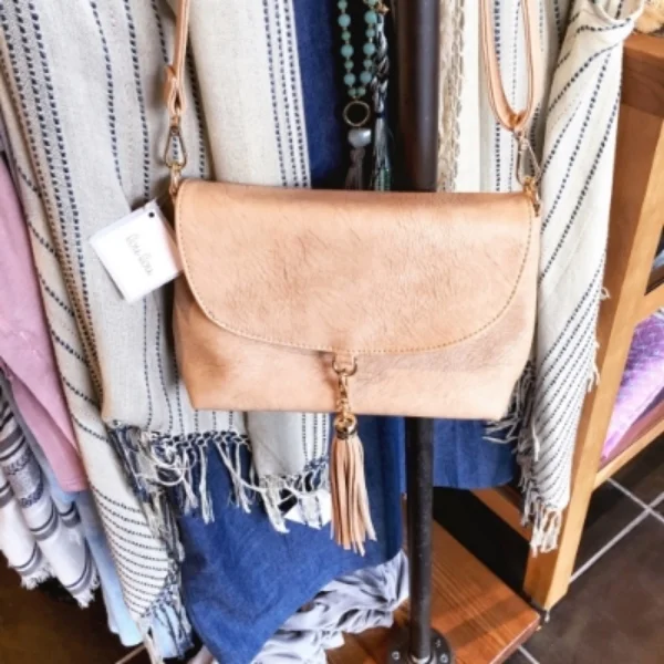 Lou Lou Neutral Tassel Crossbody Bag $28.00 Color: Beige/ Iced Coffee Tone: Warm