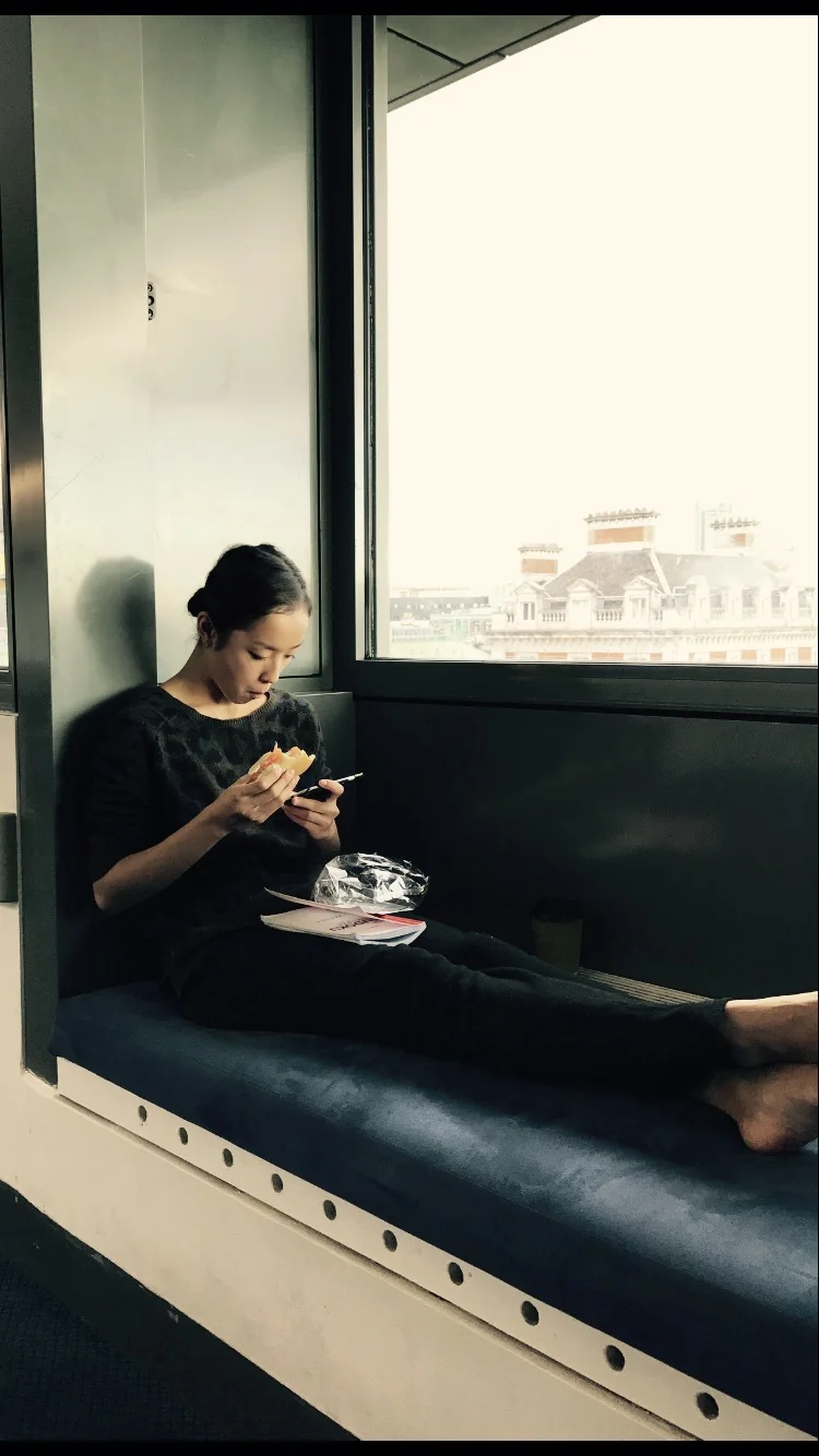 Chi in a booth in the ballet rest area