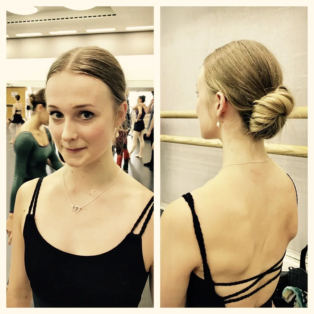 Charlotte in a centre low bun