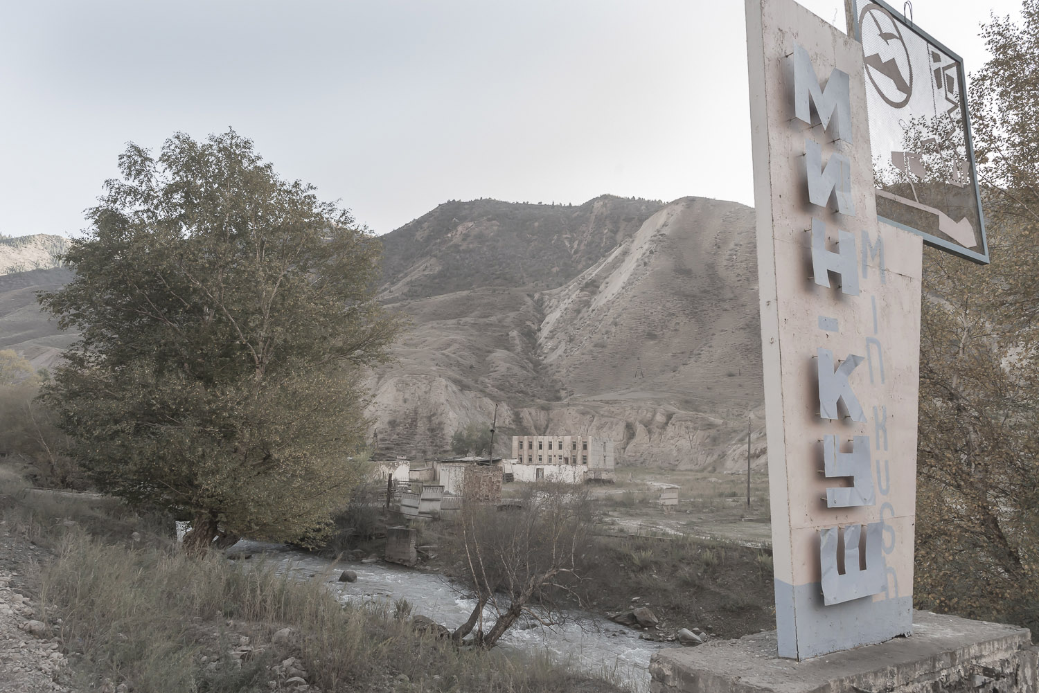 jo-Kearney-videojournalist-video-photographer-cheltenham-minkush-min-kush-Soviet-lada-rusting-Union-industrialwasteland-uranium-mining-ruins-sign-environment-hazardous-waste.jpg