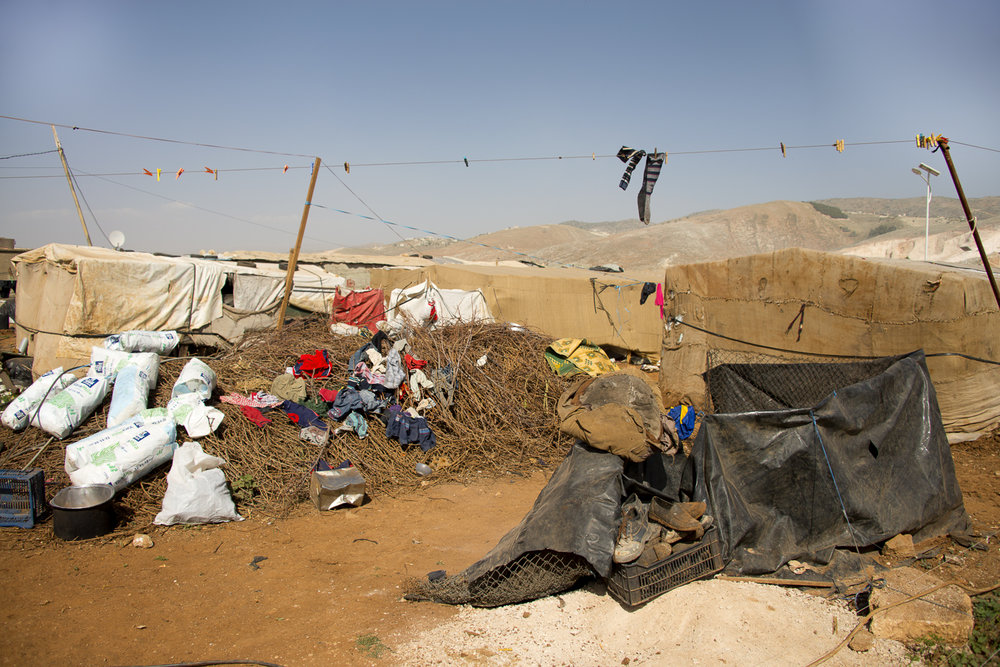 jo-kearney-photography-video-refugees-lebanon-bekaa-valley-syrian-refugees-deitrus-tents-socks.jpg