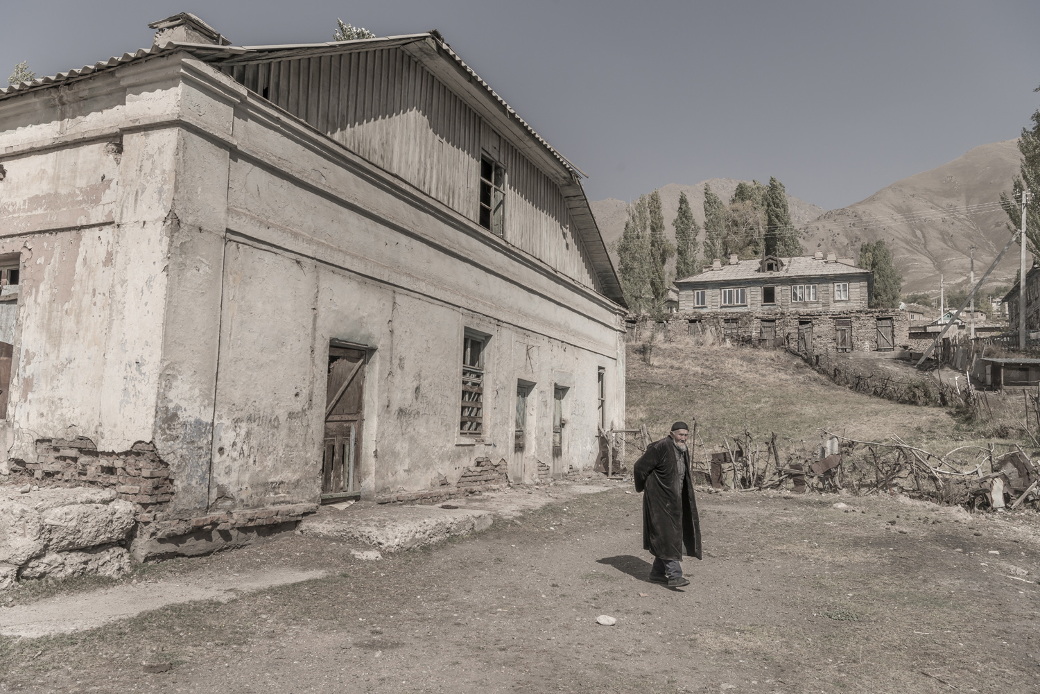 min-kush-soviet-uranium-mining-town-industrial-Russia-Kyrgyzstan-ruins-soviet-sign-jo-kearney-photos-video-photography-old-man-abandoned-town.jpg