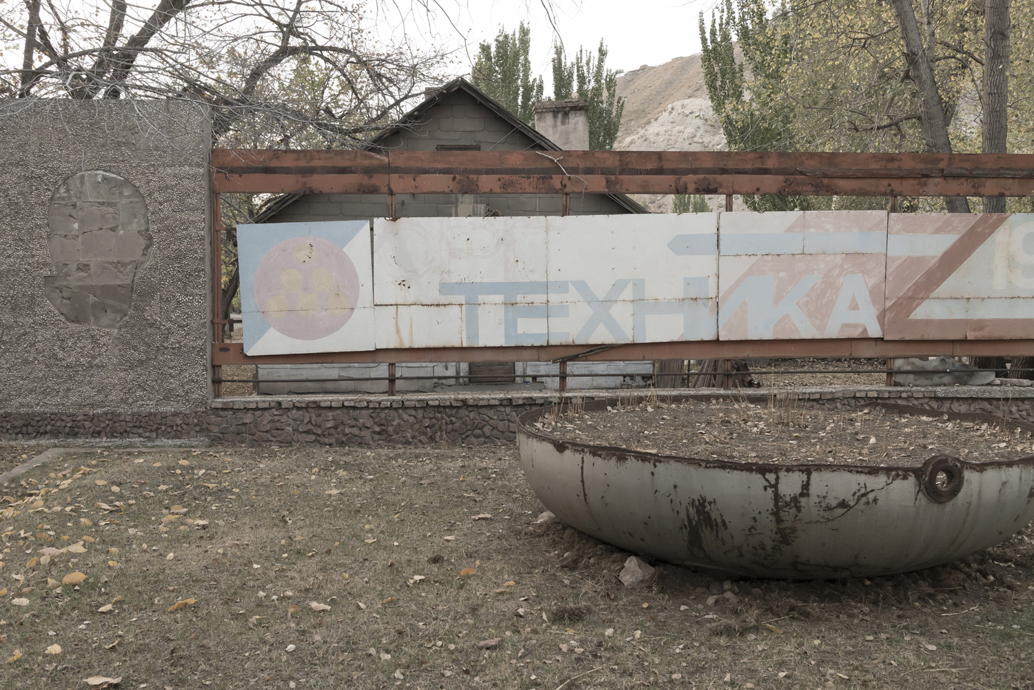 min-kush-soviet-uranium-mining-town-industrial-Russia-Kyrgyzstan-ruins-soviet-sign-jo-kearney-photos-video-photography-pen-factory-sign-soviet.jpg