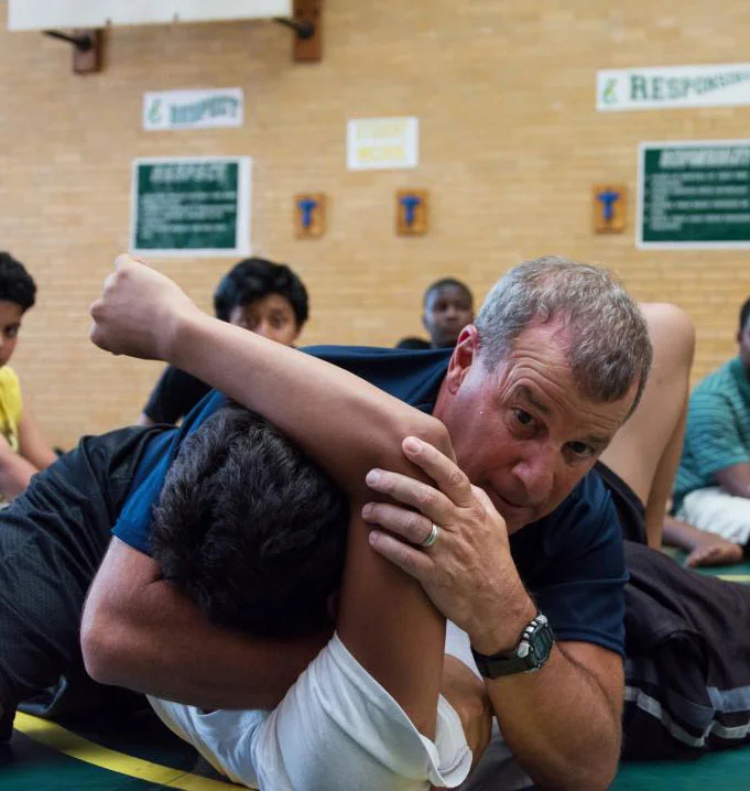 Coach Vic Caldarone, founder of The Coaches Box, demonstrates a basic pinning technique