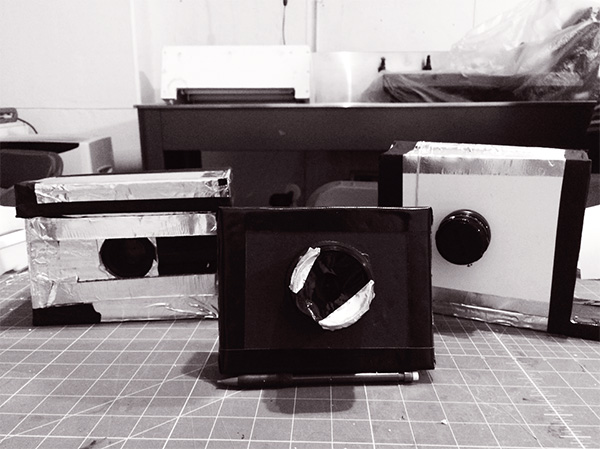 Photo from The Asheville Darkroom Facebook page (which I highly recommend you go like). Can you guess which one is mine? If you guessed the janky one in front being held up by a pencil, then you are correct! Love it.