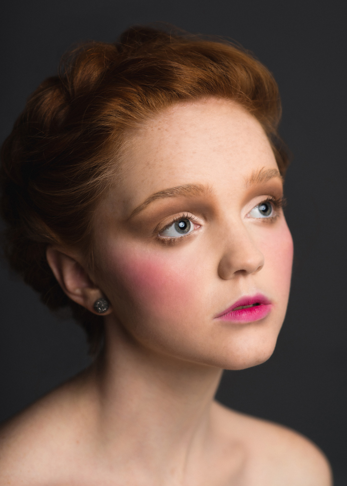 Romantic Victorian inspired studio portrait of a model with braided red hair. By Sarah Hooker Photography