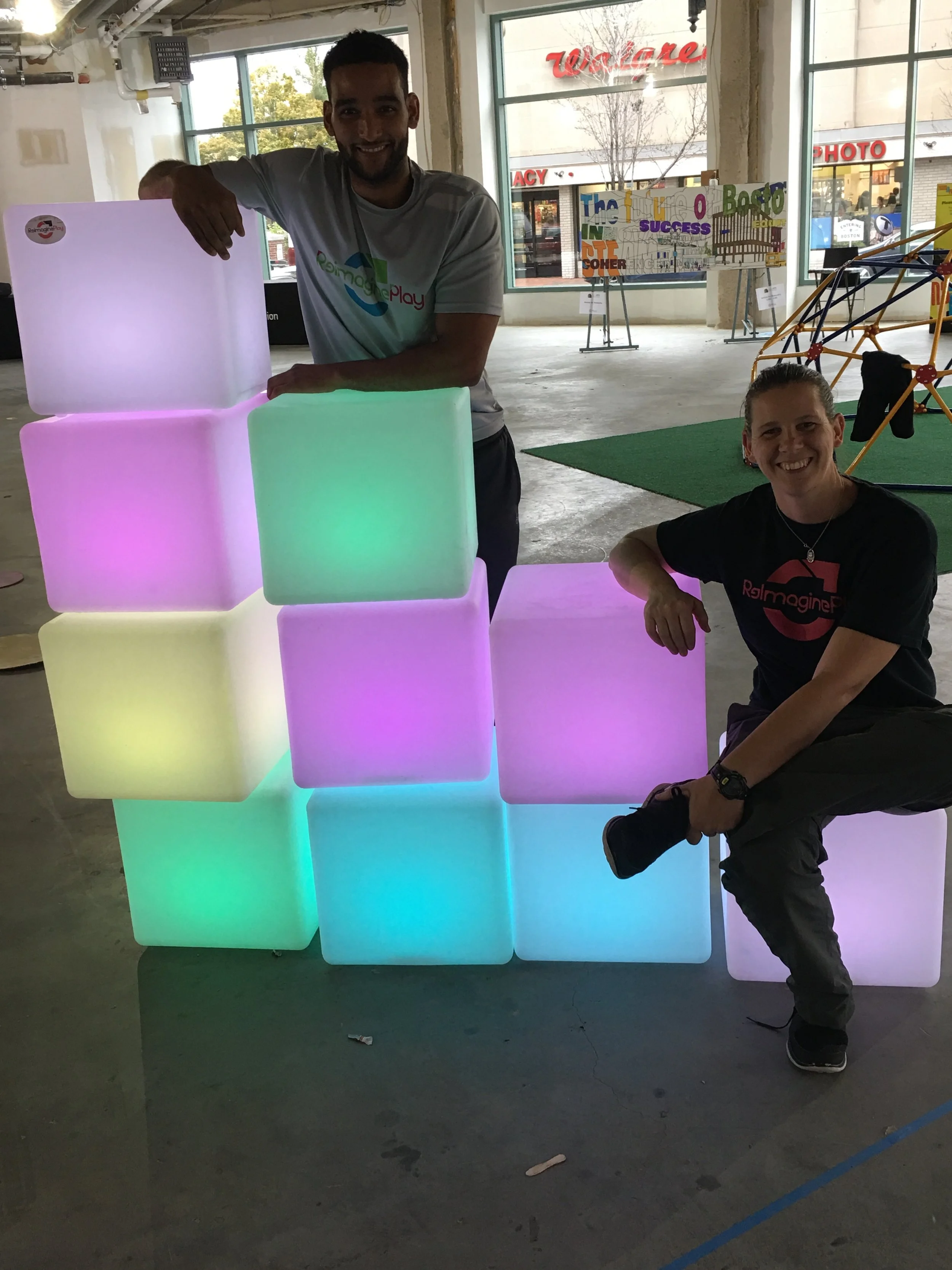 Light boxes offered a place to sit for caregivers and an interactive play activity for kids.